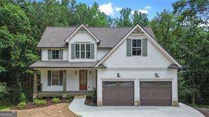Welcome to this beautifully crafted new construction home offering 4 spacious bedrooms, 3.5 baths, and over an acre of land-designed with both style and functionality in mind. From high-end finishes to smart layout features, this home delivers on every level. The heart of the home is the chef's kitchen, complete with a custom vent hood, sleek countertops, and an oversized walk-in pantry. The open-concept living space features a cozy fireplace flanked by custom built-ins-perfect for displaying your favorite books or decor. The main-level primary suite is a true retreat with a luxurious spa-style shower and a massive walk-in closet. Just off the garage, you'll find a convenient drop zone, ideal for coats, bags, and everyday organization. Upstairs, enjoy three generously sized bedrooms, two full bathrooms, a laundry room, and a flexible bonus space that's perfect for an office or study nook. The full basement is stubbed and ready to be finished, offering potential for two more bedrooms, a living area, kitchen, bath, and laundry. With its own separate driveway and private entries, it's ideal for in-laws, multi-generational living, or even rental income. Perfectly located near the interstate, shopping, and dining, this home combines modern luxury with practical living-inside and out. Don't miss this one-of-a-kind opportunity to own a home that truly has it all!