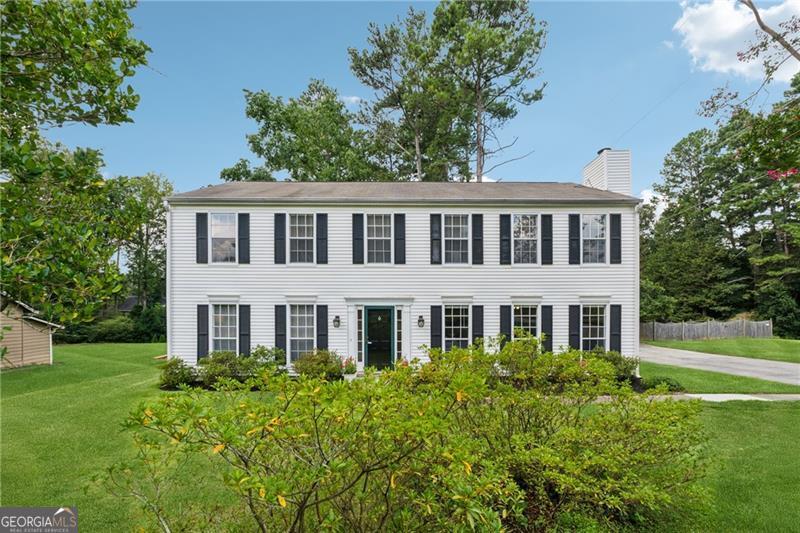 Welcome home to this beautifully updated traditional set on a fabulous East Cobb lot! Step inside to discover fresh paint and new LVP flooring throughout the main level, creating a crisp, modern feel. The spacious living room opens to an oversized kitchen and sunroom, designed for gathering and entertaining. A wall of windows floods the space with natural light, while white cabinetry, gleaming quartz counters, and a stunning island make this kitchen the heart of the home. Stainless steel appliances, including an electric range, refrigerator, dishwasher, disposal, and microwave, add both style and convenience. A large fireside bonus room offers endless possibilities, whether you need a home office, gym, playroom, or media/game room, this flexible space can do it all. Upstairs, the primary suite is a true retreat, featuring a sitting area, custom walk-in closet, and ensuite bath with dual vanities and tub/shower combo. Three additional bedrooms and a hall bath provide plenty of space for family or guests. Step outside to a fenced backyard built for outdoor living. An expansive deck is perfect for grilling, relaxing, and hosting gatherings, while a storage shed adds extra functionality. All of this in a prime East Cobb location close to I-75, The Battery, The Avenues, shopping, dining, and the brand new Eastvalley Elementary. Don't miss the chance to make this your new home. Schedule your visit today!