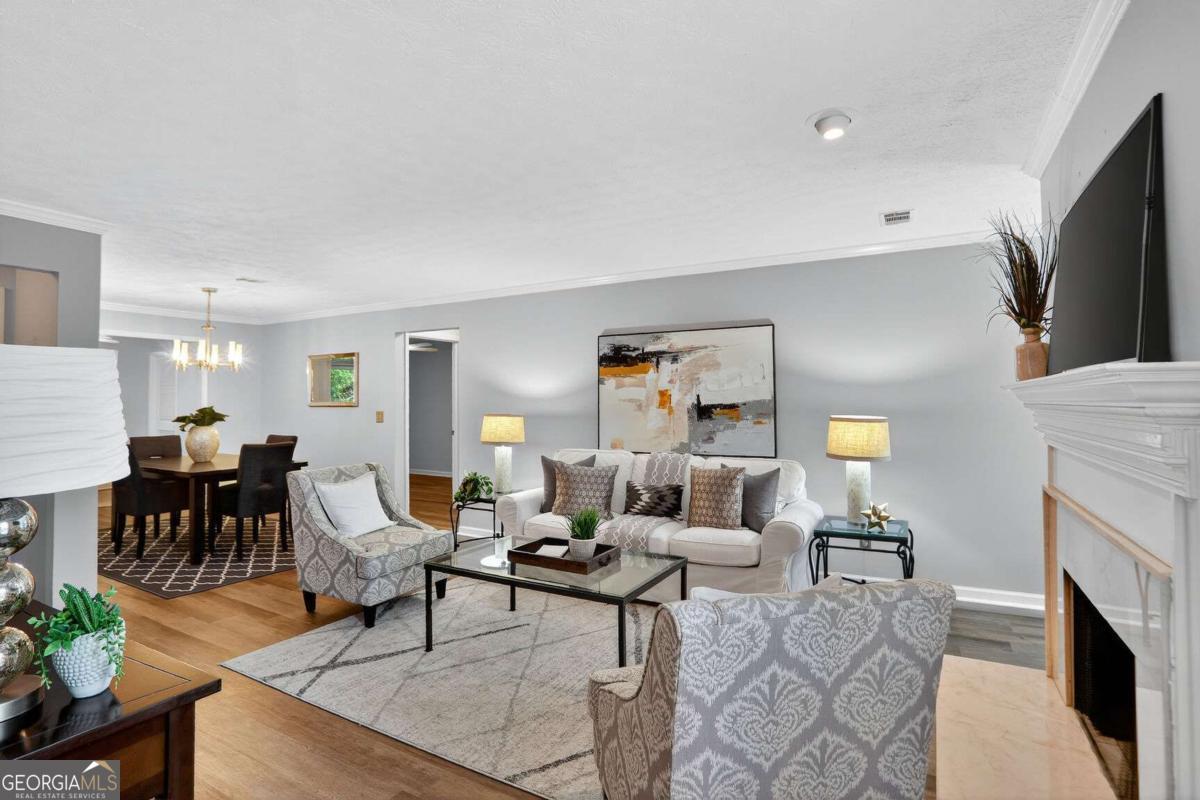 Located in the heart of Buckhead, 59 Saint Claire Lane is a part of the Walden on Lenox gated, mid-rise community offering a private and comfortable lifestyle. A dedicated exit with a traffic light provides easy access to Lenox Road to get you to major highways (400, 75/85, Buford Highway) and you are just a short drive to Lenox Mall, Phipps Plaza, Home Depot, Kroger, Target, Town Brookhaven and top Buckhead restaurants. The Buckhead Lenox MARTA Station is within walking distance and both MARTA and Atlanta Public Schools buses have stops outside the main gate. The location makes this a commuter's dream. The unit features a spacious living and dining area with a gas fireplace, a sunroom or office space off the kitchen, and an eat-in kitchen with a sun-filled breakfast room. The renovated kitchen includes sleek black granite countertops and updated pantry shelving. The primary suite has been upgraded with a renovated bath and updated shelving in the closet. A covered patio overlooks serene views of trees. This floor plan is ideal for buyers considering a roommate to help share ownership expenses. In addition, a newly installed HVAC system (January 2025) includes a 5-year parts and warranty contract and will keep you cool all summer and warm in the winter. Also, a water heater with an energy efficient heat pump was installed in 2022 and will provide plenty of hot water. Owners have a reserved parking space in front of the stairs leading to the second-floor unit, along with ample guest parking conveniently located near the entrance. Residents enjoy the peaceful, pet-friendly environment, secure surroundings, and a close-knit, neighborly atmosphere. Community amenities include a swimming pool, fitness center, and an HOA- maintained BBQ grill. Residents can also walk down to the creek-ideal for quiet mornings. The entire property is gated, with a private rear exit that leads directly into Shady Valley Park. The park features playgrounds, walking trails, tennis and basketball courts, and open green spaces. Make an appointment to see the unit today!
