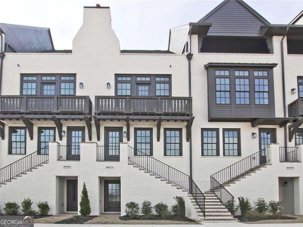 Experience the upscale, urban ARIA lifestyle! Enjoy work-life-play in vibrant Sandy Springs! Beautiful and modern 4-level townhouse, walkable to shopping and dining at Aria Village! Conveniently located next door to Mercedes-Benz headquarters, across the street from UPS headquarters, just minutes to Cox Communications, State Farm headquarters, and many more companies. Close to downtown Sandy Springs, GA400 & I-285. Easy drive north to Roswell and Alpharetta, downtown Atlanta, airport. BEAUTIFULLY APPOINTED and UPGRADED townhome! Sleek and stylish, just refreshed with all new paint. NO CARPET! Beautiful hardwood floors, gorgeous open concept kitchen, dining area, fireside living room opens to deck. Sophisticated primary suite with luxurious spa-like bath is located on the top floor along with a loft, laundry room, and access to the sky deck. Excellent storage! Finished terrace level features a huge flex room, full bathroom and 3 closets. Steps away from the resort-style pool. Requirements to rent: 700+ credit score, clean credit required, no prior evictions, non-smokers/vapers, monthly income 3X monthly rent. No cats. $6000 damage/security deposit required at lease signing. The home is tenant-occupied and will require an appointment to tour the day before.