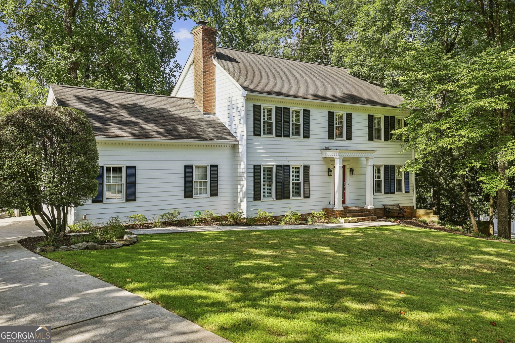 Elegant Home in the Heart of Atlanta's Coveted Pine Hills Community! Nestled between Brookhaven and Buckhead, this beautifully maintained residence blends timeless charm with modern functionality in one of Atlanta's most sought-after neighborhoods and is zoned for the Highly Acclaimed Sarah Smith School District one of the most sought-after schools in all of Atlanta. From the moment you step inside, you're greeted by Rich Hardwood Floors, Crisp White Trim Work, and Light-Filled Living Spaces that flow seamlessly from room to room. The Main Level features a welcoming Foyer Entrance with views into the Fireside Family Room, where Custom Built-Ins flank the Brick Fireplace. The Spacious Kitchen is a true showstopper with White Cabinetry, Granite Countertops, Stainless Steel Appliances, a Garden Window above the Farmhouse Sink, and a wall of windows that bring the outdoors in. A large Breakfast Nook with built-in seating that doubles as a storage drawer overlooks the backyard, while a dedicated Mudroom Area with built-ins includes a Small Office Desk/Workstation for added flexibility and function. Additional living spaces include a Formal Dining Room, and a Powder Room with custom beadboard detailing. Whether entertaining or enjoying quiet evenings at home, this main level is both inviting and functional. Upstairs, retreat to the Oversized Primary Suite featuring ample closet space and a Private Ensuite Bathroom with Dual Granite Vanities and a Frameless Glass Shower with Designer Tilework. Three Additional Bedrooms share a well-appointed Bathroom. A large Laundry Room and Custom Built-In Storage offer convenience at every turn. Downstairs, the Finished Basement with a Full Bathroom is a true Bonus boasting enough space for a Game Room, Home Office, Fitness Room, Guest Suite, or extra entertaining space. The Basement also features a Walk-Out to the Backyard, offering even more functionality. Step outside from the Main Floor to a Screened-In Porch with Vaulted Ceiling and Skylight, ideal for enjoying your morning coffee or hosting a dinner party. A Large Grilling Deck offers space for outdoor dining, and the Private, Wooded Backyard provides a Tranquil Escape with Plenty of Room for Play or Gardening. A Manicured Lawn and Sprinkler System ensure the outdoor space is both beautiful and easy to maintain. A Two-Car Garage with Storage and a Mop Sink, plus Ample Off-Street Parking, offers practical convenience, with Direct, Step-Free Access into the Kitchen. The home also includes Three-Zone Heating and Cooling for year-round comfort. Outside the home, Pine Hills residents enjoy access to a Private Swim and Tennis Club, a Recreation Center, and beautifully landscaped Green Spaces. With unbeatable proximity to I-85, GA-400, I-75, and the Buford Highway Corridor, you're just minutes from premier shopping, dining, and entertainment destinations throughout Brookhaven, Buckhead, and beyond including neighboring Phipps Plaza, Lenox Mall, and MARTA access for easy city commuting.