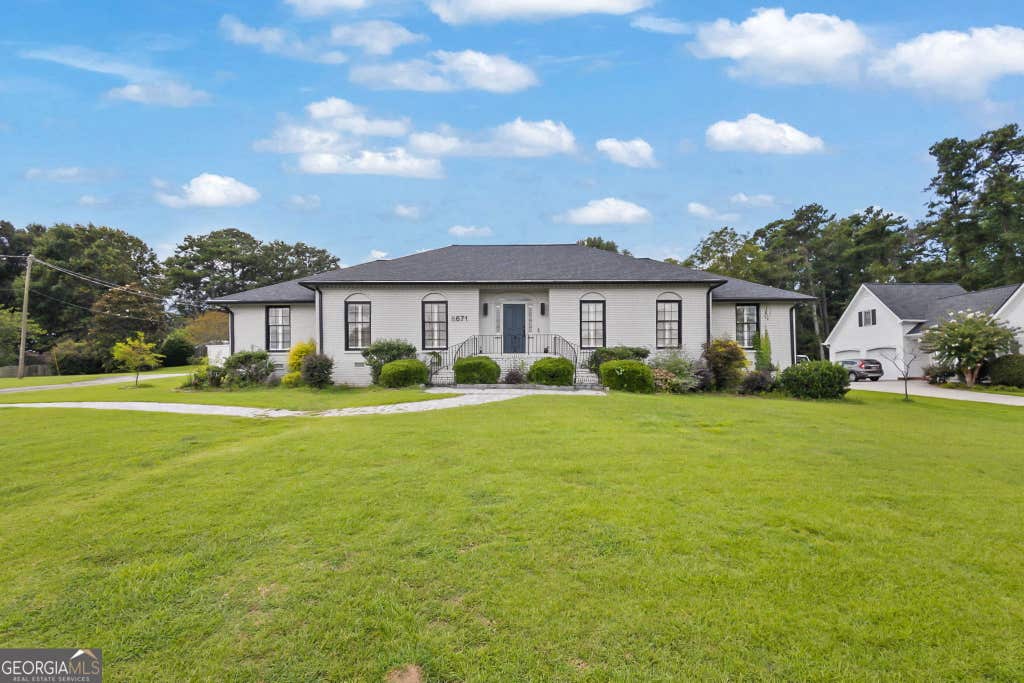 Photo of 8671 Lake Forrest Drive, Douglasville, GA 30134 (MLS # 10826539)