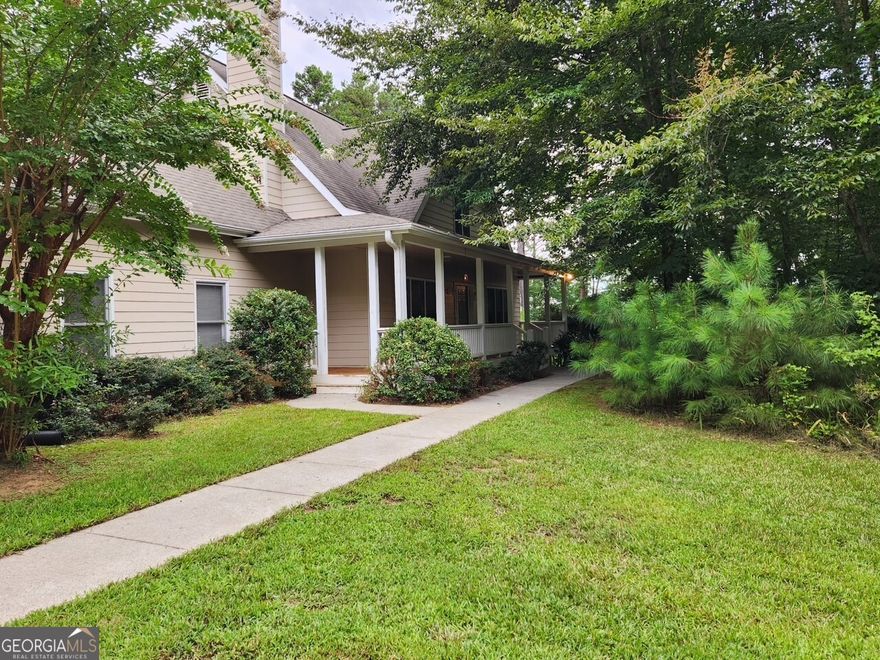 WELCOME TO 125 RAMBLING ROAD - Peaceful Living on 12+ Acres in Fairmont, GA.  Tucked away on over 12+ quiet, wooded acres, this charming property offers the best of rural living with space to roam and natural beauty all around.  Built in 2003, the home is surrounded by mature apple and pear trees, adding a touch of orchard charm to your everyday.  Step inside to discover a warm and welcoming layout, complete with a wood-burning fireplace that sets the tone for cozy evenings.  Enjoy your morning coffee or unwind after a long day on the screened-in back porch, perfect for taking in the peaceful sights and sounds of nature. While the home has been lovingly cared for, it offers an opportunity for personal touches and thoughtful updates to truly make it your own.      Whether you are dreaming of a quiet homestead, hobby farm, or weekend escape, this property delivers space, privacy, and potential in equal measure.    Experience the tranquility of North Georgia!!  A MUST SEE with lots of potential.