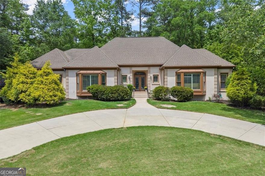 Step into this East Cobb masterpiece located in a cul-de-sac, nestled on nearly an acre of beautifully landscaped grounds and located in one of the most coveted school districts-the trifecta of Eastside Elementary, Dickerson Middle and Walton High School.   This home not only offers luxury and space, and also access to top-tier education.  Designed for ultimate enjoyment, the home features a saltwater pool-perfect for summer fun with friends and family. Love to golf? Hone your short game on the custom Celebrity Green putting green with a chipping station, right in your own backyard.  Unwind in style in the temperature-controlled, Burgundy-inspired French wine cellar-ideal for intimate two-person wine tastings and quiet moments of relaxation. Inside, stunning hardwood floors flow throughout, and the oversized primary suite on the main level offers a spa-like experience, complete with an infrared sauna in the primary bath.  Upstairs, you'll find an abundance of space with three generously sized bedrooms and two full bathrooms-perfect for growing families, guests, or creating additional work or play areas. This home truly offers room for everyone.  The fully remodeled basement adds even more flexible living space, ideal for a playroom, home theater, gym, or office, plus a full bedroom and bathroom-perfect for guests, older kids, in-laws, or a live-in nanny.  The heart of the home is the spacious, open-concept kitchen that flows seamlessly into the breakfast area and family room-another perfect gathering spot for connection and comfort.  Every inch of this home has been thoughtfully designed to blend luxury, functionality, and ease of living. With its generous layout, resort-style amenities, and access to East Cobb's top schools, this property is the total package.