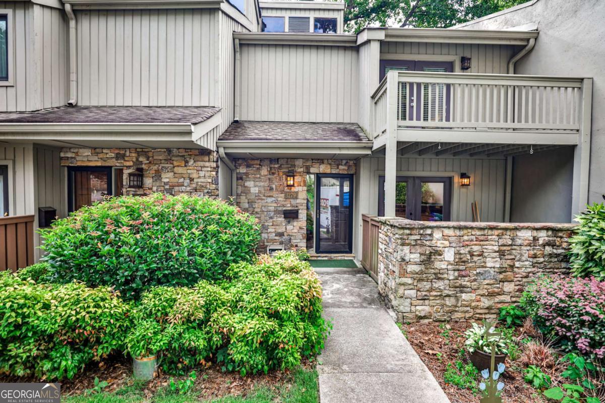 Welcome to Druid Knoll - These townhomes are in a great Brookhaven location near Dresden with shops and restaurants, near Peachtree Road, and near 85. And this townhouse is in the best location in the neighborhood. It backs up to the privacy of the woods and this section was rebuilt in the past 8 years. It boasts several outdoor spaces with a covered front patio off of the kitchen, a screened in, large back porch, and a deck off the master bedroom. the kitchen has an opening into the large den which has plenty of space for a dining room table. There's also a powder room on the main level. Upstairs is the master suite which has a lot of closet space and french doors which go to a large deck. It also has an en suite bathroom. The laundry is in the hall as is the shared bathroom for the other 2 bedrooms. The sellers are offering $3000 towards the buyers closing costs so the buyers can replace carpet if they want.