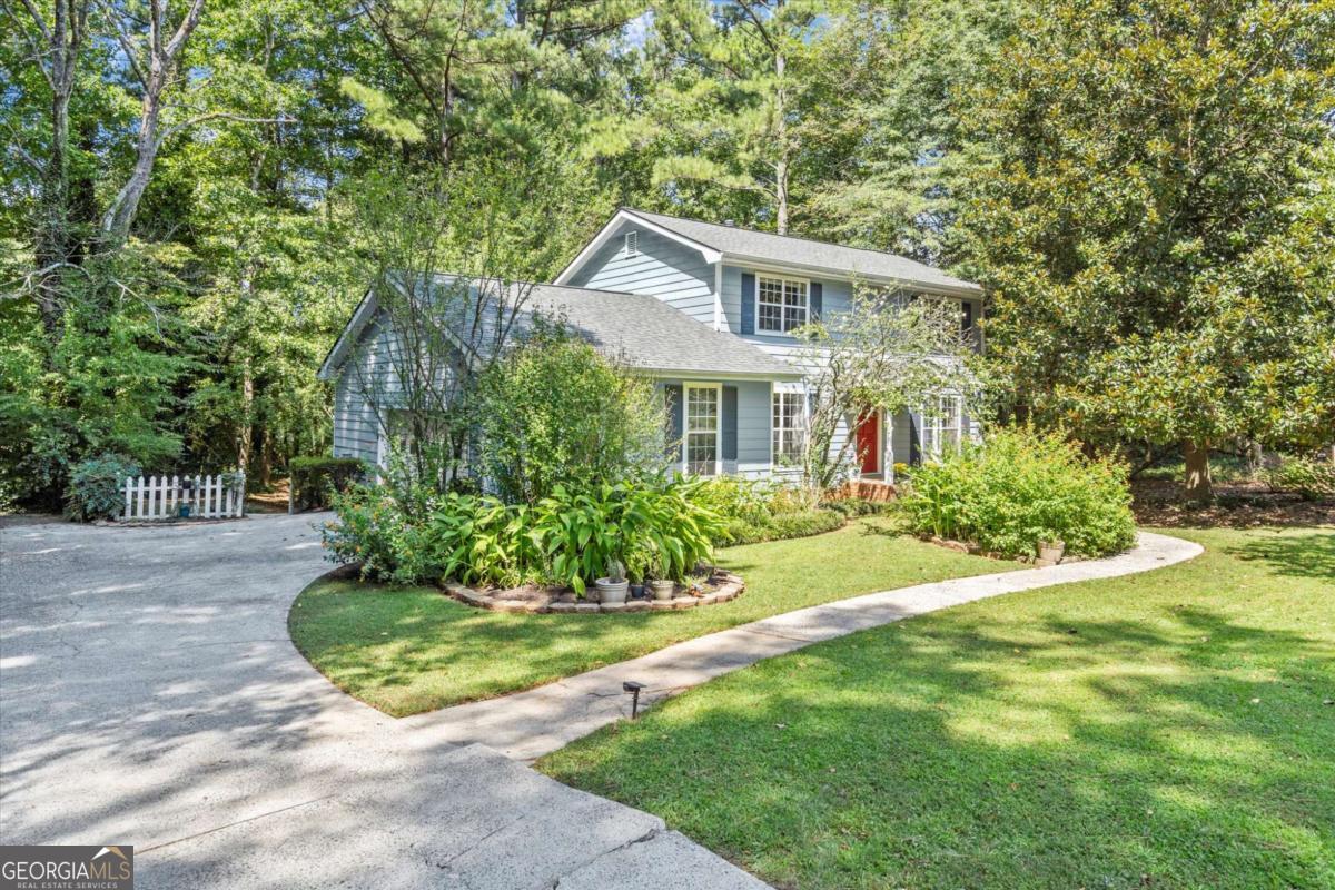 This lovely house is waiting for you to call it HOME. Located in North Landing-a true gem in the sought-after Kell Cluster School district. This 4 bedroom and 2 and a half bathroom home offers so many conveniences! It's located in a quiet cul-de-sac, on a beautifully landscaped garden and a very large fenced flat lot. Enjoy the lovely butterfly garden and entertain your family and friends on the recently maintained and painted back deck. The main level offers a living room and a family room, a breakfast area and a separate dining room, a walk-in pantry and laundry area next to the spacious kitchen. A convenient flex room that can double as a bedroom or an office right next to the bathroom completes the first level. The three bedrooms upstairs are spacious, especially the oversized primary bedroom, which can accommodate a sitting area for your end of day relaxation time. Here are the latest improvements: Updated bathrooms, including tiled floors. Hardwood and LVP flooring through out. New HVAC installed in 2023, and was recently serviced. New roof installed 4 years ago and bathrooms updated in 2018. The North Landing community offers a VOLUNTARY HOA! Amenities include a 14-acre lake for fishing, a salt water pool, two lighted tennis and pickleball courts, extensive grounds, an 18-hole Disc Golf course, children's play areas, and a Clubhouse, which is available for rentals. For more information on voluntary HOA: northlandinghoa.com This charming home is conveniently located close to top rated schools, shopping, entertainment, and access to main highways I-75 and I-575. It is truly a wonderful opportunity at a fantastic price. Don't miss it!