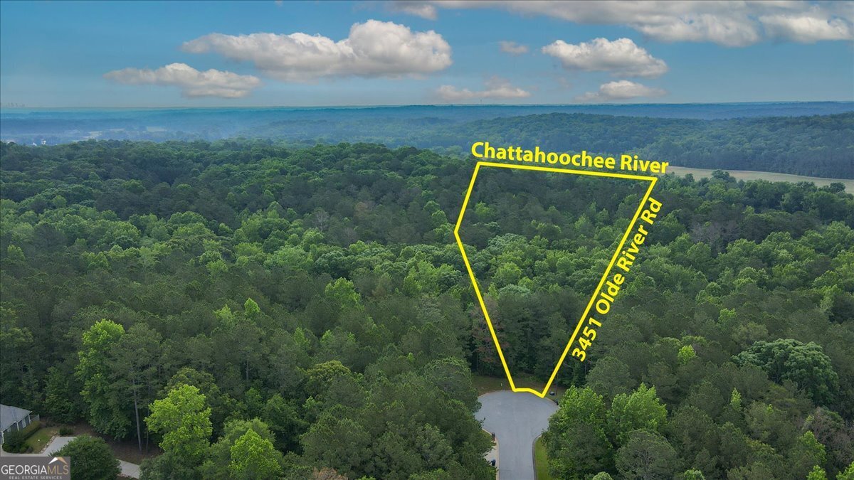 Escape to the tranquility of the countryside and discover a haven of peace on the Chattahoochee River. With your vision and the expertise of your builder, craft the perfect retreat amidst the charm of this wooded estate within the esteemed Olde River Plantation community. Spanning just over 26 +/- acres, embrace boundless opportunities to create your ideal home, surrounded by lush privacy. Easy access to HWY 92, Chapel Hill Road, and HWY 5 offers a simple route to I-20, Arbor Place Mall, the Atlanta Airport, as well as Lions Gate Studios.