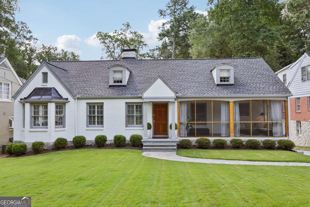 Discover a beautifully updated Morningside home on the highly sought-after Wildwood Road. This expanded and updated residence, originally a ranch, features four bedrooms, four baths, and a separate home office/study, all complemented by a large, lush backyard. As you step inside, you'll find a welcoming living room with a fireplace and a separate study. The main floor features a primary suite, a second bedroom, and a full guest bath. The front of the home boasts a large screened porch, perfect for enjoying a morning coffee. A well-equipped kitchen with stainless steel appliances and a dining room complete the main level. Upstairs, a third bedroom and another guest bath await, along with a spacious laundry room and a large unfinished area that presents a wonderful opportunity to add an additional bedroom or a new primary suite. The terrace level is ideal for guests, offering a private bedroom and a brand-new full bath. A large, unfinished space on this level provides high ceilings and a second laundry area, with direct access to a covered patio and an outdoor kitchen. This home has been thoughtfully updated with a new driveway, a new motor court, and an electrical hookup ready for a future garage or carport. Recent updates also include a new roof, new landscaping, three updated bathrooms, new appliances, and beautifully refinished hardwood floors. This home is ready for you to move in and enjoy, but it also offers incredible potential for future expansion.