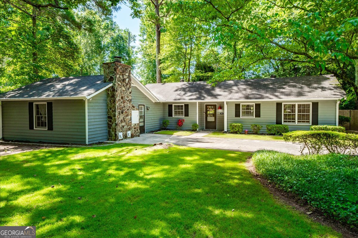 Welcome to The Cottage! This charming 4-bedroom, 3-bath ranch home is ideally located in the Roswell/East Cobb area. Situated in an award-winning school district in a sun-dappled neighborhood, 4361 Old Mabry Ln sits on a corner/cul-de-sac lot spanning over half an acre. It's conveniently close to shops, restaurants, parks, Downtown Roswell, Downtown Woodstock, and all the top sites in Marietta. The home has been well-maintained, featuring a renovated master bathroom, LVT flooring, two fireplaces, a fenced back yard, and plenty of natural light throughout the house.