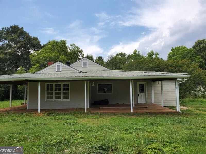 18+ Acres of Land! 3 Bedroom 2 baths Farmhouse with Renovated Interior, Hardwood Floors, Separate Dining/Office Room, and Bonus Room. Wrap Around Front Porch, Quonset/Storage Out building, endless Pasture, relaxing Creek, inclusive Serene Lot, abundance of Nature...all on 18+ Acres of beautiful Land! Don't miss this true Gem!