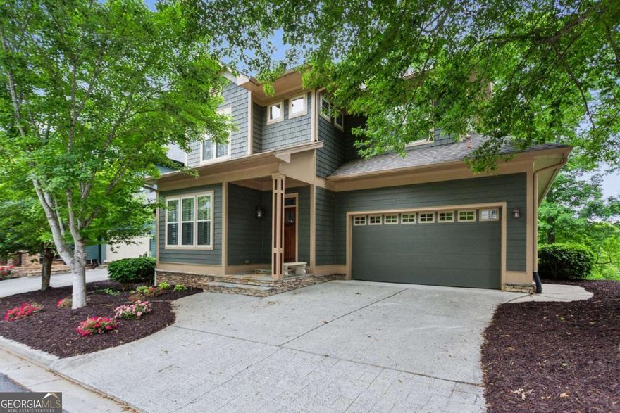Renovated primary on main home in gated Enclave at Laura Creek with views of Noonday Creek! 2765 Prado Lane offers low maintenance living with recent renovations and HOA maintained landscaping. The community is walkable to shopping and restaurants and provides easy access to 75/575, Noonday Park/Trail, East Cobb, Marietta Square, KSU, West Cobb, Truist Park, Downtown Woodstock, Roswell, Publix, Barnes and Noble, Whole Foods, Orange Theory, Town Center, Towne Lake, Barrett Parkway, Outlets at Ridgewalk, and more. The main level features hardwood floors, 2 sided gas fire place, sunroom/office, updated kitchen, 10' ceilings, large primary bedroom suite, primary bathroom with double granite vanity, walk in tile shower, jetted garden tub, primary closet with custom shelving, laundry room, large garage, powder room, and screened porch extending to renovated deck with views of creek and park. The kitchen includes painted cabinetry with upgraded hardware, granite counter tops, tile back splash, stainless steel appliances, gas cooktop, two large pantries, and island. Upstairs provides 3 large bedrooms, walk in closets, and bathrooms renovated with tile surround showers and painted cabinetry. The finished daylight basement has a large recreation room with projector screen for a home theater, additional bedroom/office spaces, storage, full bathroom with walk in shower, and opens to the covered patio with an outdoor fireplace. Additional highlights are new paint, plantation shutters, transoms, upgraded trim, hardie cement fiber board and shake exterior, newer roof, fenced backyard, community playground, and gated community.