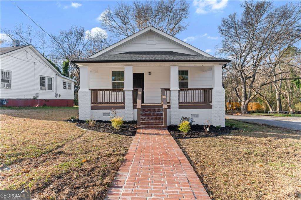 Investment Opportunity! Fully renovated 2-bedroom, 1-bath home just minutes from downtown Rome, schools, parks, and the river. This open-concept home features granite countertops, stainless steel appliances, walk-in closets, and new flooring throughout. Recent upgrades include newer roof, HVAC, windows, and insulation for energy efficiency. Rocking chair front porch with brick pathway. Currently tenant occupied, professionally managed, and leased for immediate income.