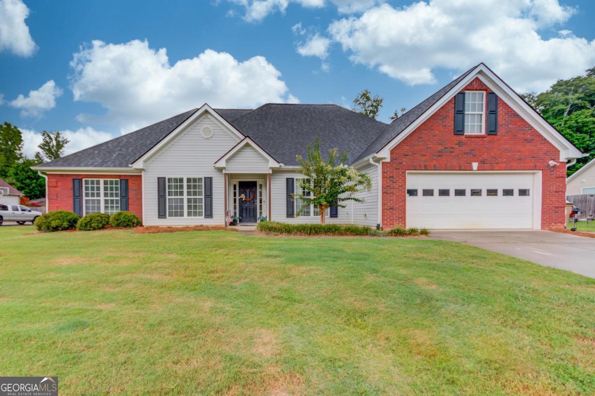 Beautifully maintained 4 bedrooms, 2.5 bathroom ranch home. This home offers an additional office room with French doors, new paint in the main floor bedrooms, bathrooms, and laundry room, LVP flooring in common areas, formal dining room, custom travertine tile backsplash and granite countertops in the large kitchen that also has an elevated countertop bar and large eat-in area. Outside you will find a recent upgraded oversized covered back patio overlooking a wonderfully sized backyard, ready for you to make it your own oasis. The front yard is also a great size with plenty of driveway space. Located in a small, no HOA, subdivision that is highly sought after within minutes to I-85, yet nestled away from interstate traffic and noise.