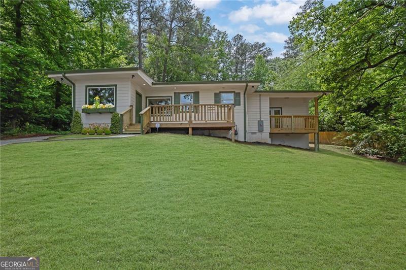 Step into a home that blends modern comfort with timeless charm-fully remodeled and move-in ready! This beautifully updated 3-bedroom, 2-bath residence welcomes you with a bright, open floor plan, fresh paint inside and out, and stylish finishes throughout. The heart of the home is the stunning kitchen, featuring white shaker cabinets, granite countertops, stainless steel appliances, and elegant fixtures that make everyday living a delight. The updates continue in both bathrooms, where you'll find new vanities, custom tile work, and thoughtful touches designed for comfort and convenience. The spacious master suite is a true retreat with soaring ceilings, a large walk-in closet, and a luxurious en-suite bathroom complete with a double vanity and a beautifully tiled shower. Step outside onto your private deck or front balcony-both offering peaceful views of mature trees and a serene landscape. A unique bonus is the hall bathroom's dual-purpose design, doubling as a laundry room with storage cabinets and a travertine-tiled tub/shower combo-perfect for maximizing space and functionality. But the charm doesn't stop at the front door. Outside, the property shines with a large, private lot that includes a sloping front yard and a partially fenced backyard-ideal for entertaining, gardening, pets, or playtime with the kids. And here's where this property really stands out: a massive 750+ sq. ft. detached garage offers incredible versatility. Whether you need a workshop, studio, space for your business, vehicle storage, or your next creative project, this garage delivers endless possibilities. It's a dream come true for artists, woodworkers, small business owners, car enthusiasts, and entrepreneurs alike. Located just minutes from I-20, Six Flags, downtown Atlanta, shopping, dining, and top-rated schools, this home combines the peace of a secluded setting with unbeatable convenience. Investor-owned with no seller's disclosure, no HOA, and a 1-year home warranty from American Home Shield included. If you're looking for a home that works as hard as you do-with style, space, and serious potential-schedule your private tour today and see what makes this property truly one of a kind!