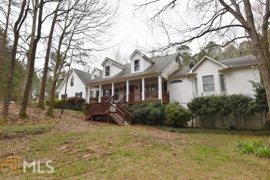 Beautiful 2 story plus home on 2.06 acres in Monroe, Ga. Main floor contains fabulous hardwood floors, dining room, breakfast area and breakfast bar, huge kitchen with stainless refrigerator, stove, 2 dishwasher's, solid surface counters, 1 bed room off the kitchen and half bath, laundry room with laundry sink, butler pantry walk in pantry, huge masonry fireplace, master on the main with sitting area double vanities, separate shower, jetted tub, another bedroom on the main. A millennial suite is located upstairs with full bath and bedroom. Fully finished basement with in law suite, great rm, media rm and another bed room. Seller is open to any repairs (Not Cosmetic) requested by the Buyer. Make an offer!