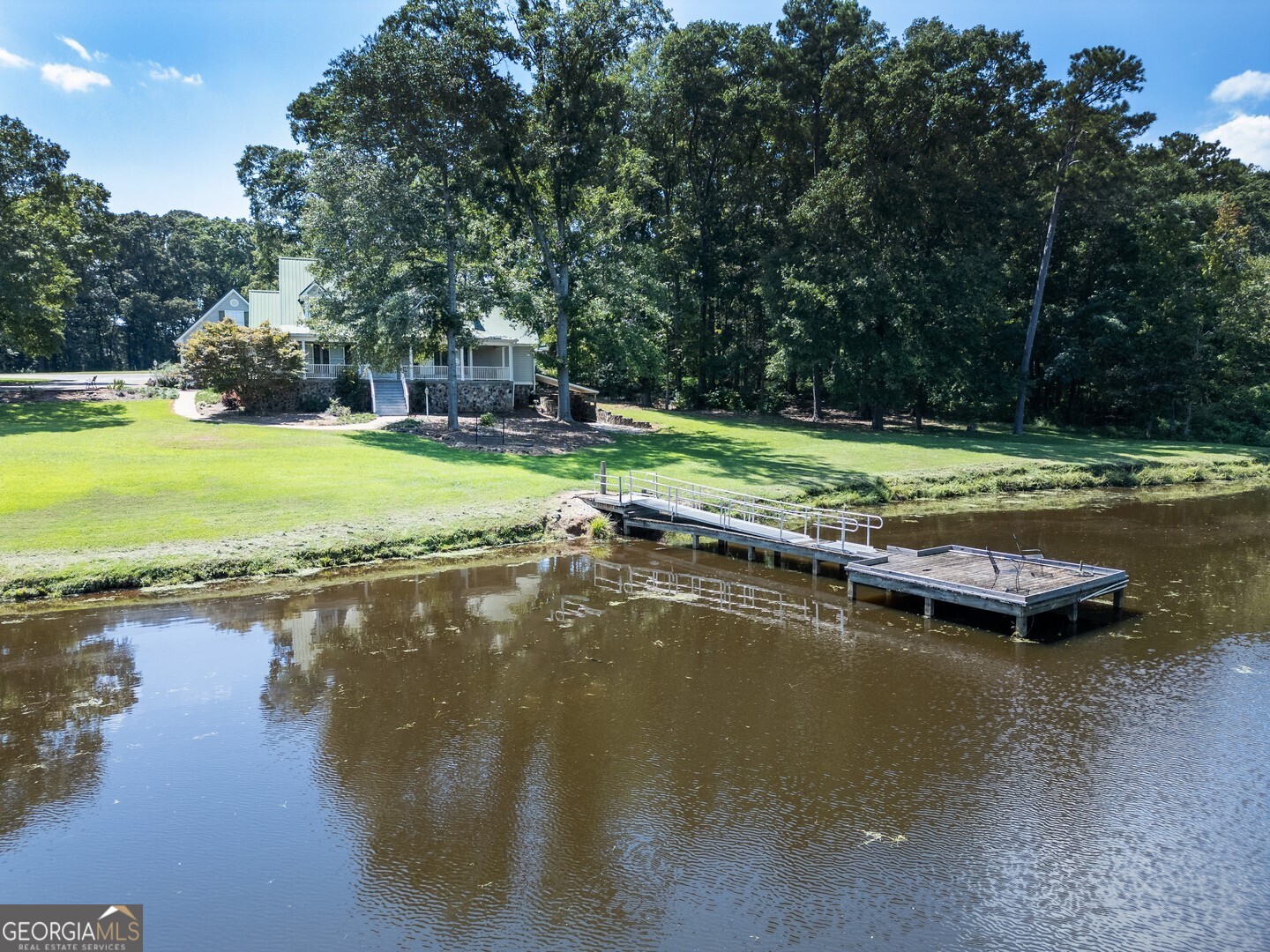 Beautiful 20-Acre Farm in Jackson! Tucked away at the end of a long private driveway, this secluded property truly has it all. The land features a garden, a shop, circle driveway, fencing, and a 2-acre stocked pond, perfect for fishing or relaxing by the water. This home offers over 3,700 sq. ft. on the main level with 5 bedrooms and 3 full baths, plus a finished 1,500 sq. ft. basement. The owner's suite is conveniently located on the main level and includes a walk-in closet. Plenty of deck space designed for entertaining and enjoying the outdoors. This is a rare opportunity to own a house with plenty of space and acreage for this price. Call and schedule a visit today!