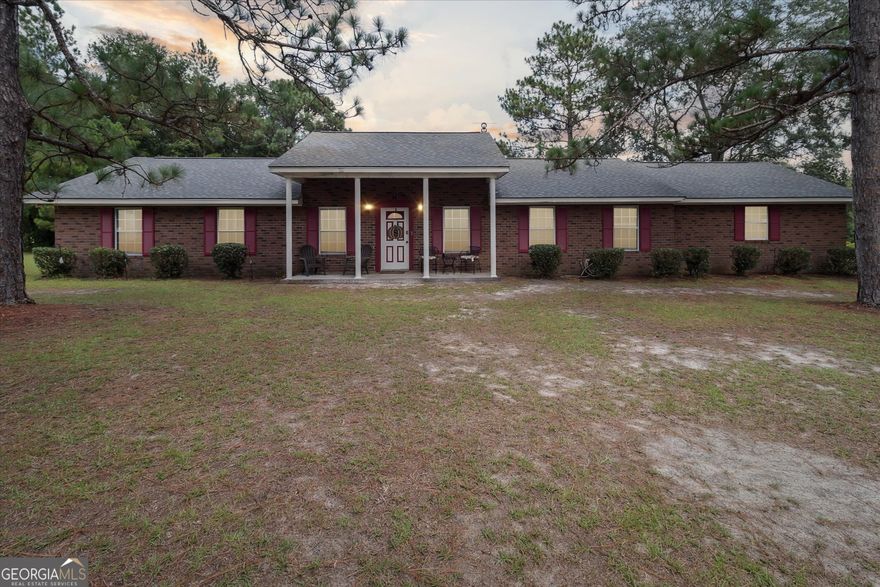 Welcome to your own private oasis that features 5 bedrooms, 3.5 baths on 10 acres of land. The large Master Suite includes a sitting area, large walk-in closet, linen closet, and an oversized tub w/ separate shower, a single vanity w/ make-up area and mirror, which are all separated from other 3 bedrooms and baths. Upstairs contains an additional bedroom with a sitting area and walk-in closet. The home has a beautiful Great Room w/brick fireplace that flows into the Sunroom. This stunning home boasts a private pond, perfect for fishing or simply enjoying the serene views. The property also features a separate workshop area with a 1/2 bath and kitchen, which would be a great spot for entertaining. If you ever thought about growing your fruits and veggies, think no more. The garden currently has 14 raised beds, and several fruit trees, ie..... peach, plum, apple lemon, limes, figs and so much more which are protected by an electric fence to keep the animals out. Relax and enjoy, country living!
