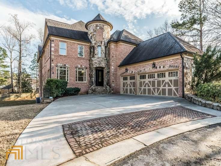 This custom-built home is a pleasure to tour. The open floor plan provides great light, a natural flow, and casual elegance.  The home sits on a private cul-de-sac in a prime Sandy Springs/Dunwoody location. The exterior is 4 side brick & stone with a dramatic  front entrance & private deck with w/outdoor fireplace. Interior boasts an impressive CHEF'S gourmet kitchen, walk-in pantry, and butler's pantry.  Master on main suite with a great sitting area and fireplace. Custom closet & amazing spa-like bath w/whirlpool tub and tiled shower w/dual showerheads. Paneled library/office with built-in bookcases, designer hardwoods throughout, trey ceiling, wrought iron balusters, and other architectural details.  2 living areas, a spacious dining room, and  4 large bedrooms & en suite baths upstairs with open bonus room.  The unfinished basement awaits your personal touch.