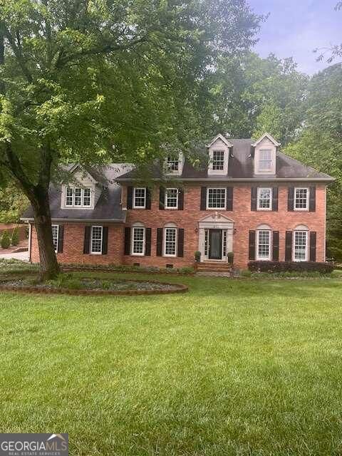 Photo of 871 Cedar Trace SW, Lilburn, GA 30047 (MLS # 10545339)