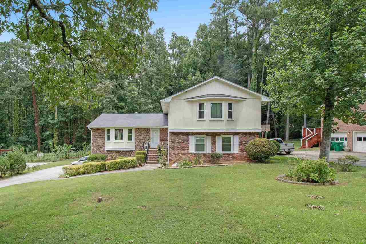 Beautiful clean and well kept Stone Mountain home in a quiet neighborhood . This split level property has 4 spacious bedrooms, large family room, sunroom that leads to a deck, fireplace, dinning room, eat-in kitchen, large room with bar that's perfect for entertaining friends and family. Please bring your best offer. No HOA and easy access to 285 and 20.