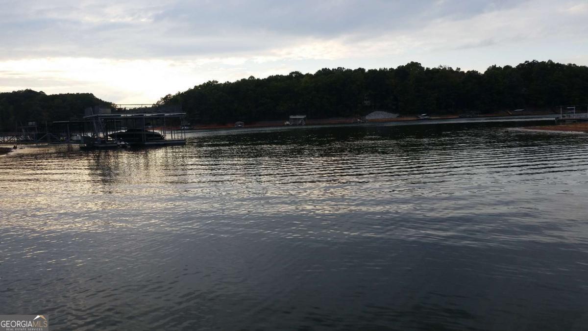 Beautiful lot for sale in the established Ridgewater On Lanier subdivision. A resort-style neighborhood with a clubhouse, swimming pool, tennis courts, community dock, and great views of Lake Lanier. Conveniently located near North Georgia Premium Outlets, shopping, and dining. A five-minute drive to the Toto Creek Park boat ramp. A fantastic opportunity to build your dream home!
