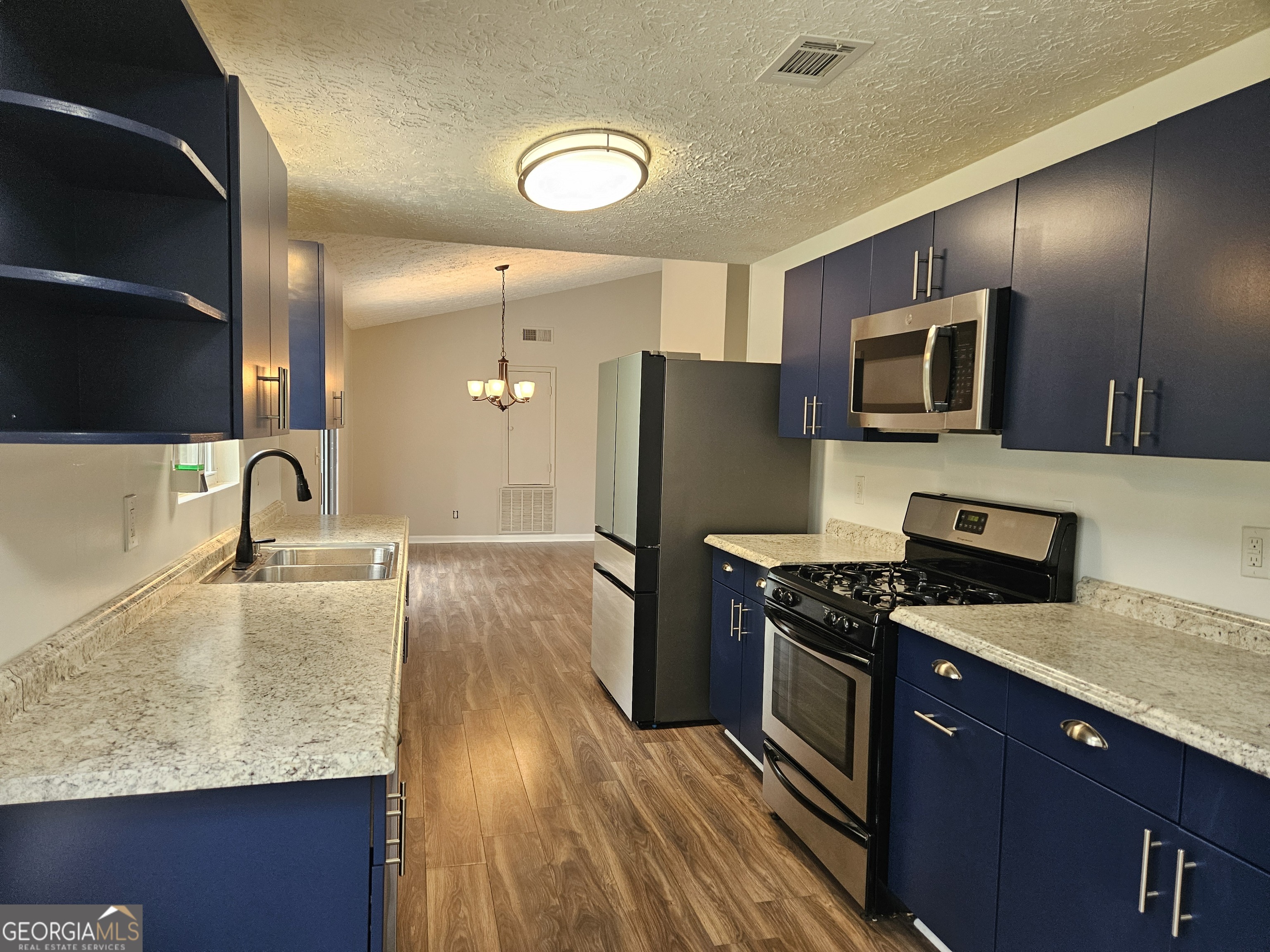 Just minutes from I-75, I-575, KSU, Town Center Mall, and endless shopping and dining, this charming 3-bedroom, 2-bath ranch offers the perfect blend of comfort and convenience. Step inside to find a freshly painted, fully remodeled home featuring an updated kitchen with abundant cabinetry, modern tiled showers, and a bright, welcoming layout. Outside, enjoy a level yard with a brand new fence, spacious concrete patio, and ample parking plus a two car garage for extra storage. With no HOA restrictions and located in a highly rated school district, this home is ideal for families or anyone looking for easy living in one of Marietta's most desirable areas.