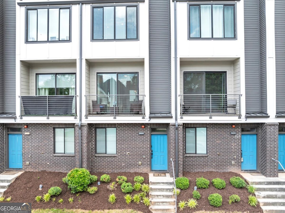 In-Town Elegance Meets Modern Luxury! If you've been searching for the perfect blend of style, space, and location, this is the one. This custom FOUR-story townhome features 3 spacious bedrooms each with private en-suites, 2 half baths, and is drenched in natural light from top to bottom. Every level showcases hardwood floors, and the striking custom stainless steel cable railing system adds a modern architectural touch. The chef's kitchen stands out with a cooktop stove, stainless steel appliances, marble island, and elegant backsplash-all flowing effortlessly into the open-concept living area. A small patio off the living room adds charm and outdoor versatility. Retreat to the owner's suite with its walk-in closet, spa-like bathroom featuring custom tile floors and a luxurious walk-in shower, your own private sanctuary. The top floor boasts a media/theater room and opens to a private rooftop deck with breathtaking evening views of Downtown Atlanta-perfect for entertaining or relaxing under the stars. Located in the heart of the Summerhill District, enjoy walkability to restaurants, shopping, two Beltline access points, and major Atlanta landmarks including Downtown, Mercedes-Benz Stadium, Georgia State, Zoo Atlanta, Grant Park, and more. Publix is less than a mile away! Located in a gated community with an attached garage, additional private parking, and street parking right at your doorstep. With the upcoming 405 Cooper Street Development and the World Cup coming to Atlanta in 2026, this home is not just beautiful, it's a bold investment in a thriving neighborhood. Quick access to I-75/85, Hartsfield-Jackson Airport, and key destinations. Come home to elevated living in one of Atlanta's most vibrant communities. SELLER WILL NEGOTIATE LEAVING FURNITURE WITH FULL PRICE OFFER. Current tax rate does not reflect Homestead exemption which is now estimated at $6396 annually for 2025. Seller has filed Homestead Exemption.
