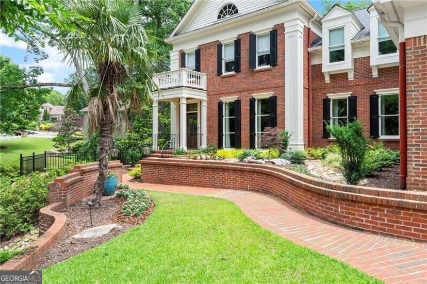 Exceptional home in Atlanta Country Club on a quiet cul-de-sac is enhanced with refined architectural details such as window transoms, privacy alcoves, high profile molding, stair landings and much more. The professionally designed and renovated residence offers a cohesive and timeless transitional style throughout making it turnkey ready.    Upon entry, a two-story foyer will greet you with a truly elegant staircase and dramatic windows. A formal living room is adjacent to the entryway. A spacious but warm family room with coffered ceilings opens seamlessly to a sophisticated kitchen with marble countertops, Sub-Zero refrigerator, Thermador gas range, KitchenAid appliances, warming drawer, prep sink and banquet seating. A butler's pantry with wine fridge and glass cabinetry adds elegance while connecting the kitchen and dining room which easily accommodates 12 guests.   The main level also offers a chic powder room with alcove entrance as well as a full bath with hidden shower, two large storage closets, and an expansive laundry room with built-ins and a desk area. A portico covered private back entry leads into an access hallway with a mudroom and connects to the main laundry room.    Upstairs the newly expanded Primary Suite is entered through a private sitting room with a fireplace. The oversized bedroom showcases a wall of windows with a stunning view of the pool and a fireplace. A true dressing room houses four custom, built-in armoires. The suite features His & Her walk-in closets.  The fresh, all white primary bath includes a steam shower, heated floors, dual vanities, water closet and heated towel rack.   Additionally, two more bedrooms with walk in closets are connected by a true Jack and Jill bath. A third secondary bedroom has an ensuite bath with a walk-in closet. A fourth "suite style" bedroom is accessed by a private staircase, ensuite bath and walk in closet. This large suite would be ideal for a nanny, guest or other.  A secondary laundry room is located upstairs for convenience.   A sixth bedroom with ensuite bath is on the lower level. The fully finished basement opens to a sunny spacious living area with a fireplace and leads to a fully equipped kitchen with double ovens, dishwasher, refrigerator and granite bar. Additionally there is a soundproof media room, weight room with sauna and a powder room.  Enjoy year-round outdoor living on the covered porch featuring new Eze-Breeze windows, infrared heaters, and a cozy fireplace. The walk-out terrace level showcases an infinity-edge pool, brand-new paver pool deck (2024), hot tub with waterfall, outdoor kitchen with grill, sink, refrigerator, granite counters, bar seating, and a freestanding fireplace-plus ample yard space beyond. Three-car garage with epoxy flooring. Ample parking in the driveway. This is luxury living at its finest in one of Atlanta's most prestigious communities.