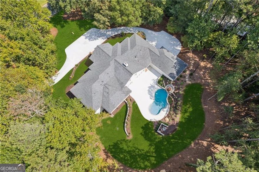 Completely Upgraded Luxury Home with Saltwater Pool in Alpharetta's Coveted Hopewell Plantation    Welcome to 2355 Hopewell Plantation Drive - a truly stunning residence that has been 100% upgraded with the highest-end finishes, offering an unmatched combination of modern luxury, functionality, and timeless design.    As you arrive, you'll notice the brand-new concrete driveway, professional landscaping, and all-new gutters that highlight the meticulous exterior updates. Step inside to discover an expansive open floor plan anchored by a massive chef's kitchen island, state-of-the-art appliances, and elegant finishes designed for both entertaining and everyday living.    The main living spaces open seamlessly to refinished covered rear deck, overlooking your private backyard oasis. Here, a custom saltwater pool with waterfall feature creates the ultimate retreat, surrounded by lush landscaping for beauty and privacy.    The partially finished terrace level adds flexibility with a spacious recreation room and a full bathroom - ideal for entertaining, guests, or a future expansion.    Car enthusiasts and hobbyists will love the all-new garage doors leading to a huge workshop with soaring ceilings, providing ample space for projects and storage.    Additional highlights include:    Completely upgraded interiors with luxury finishes throughout    Saltwater pool with waterfall feature    All-new covered rear deck for year-round outdoor living    Professional landscaping and new concrete driveway    Partially finished basement with full bath and recreation room    All new garage doors and oversized workshop with high ceilings    This home represents the rare opportunity to own a like-new residence in one of Alpharetta's most sought-after communities. With every detail carefully considered and executed, 2355 Hopewell Plantation Drive is move-in ready and designed to impress.