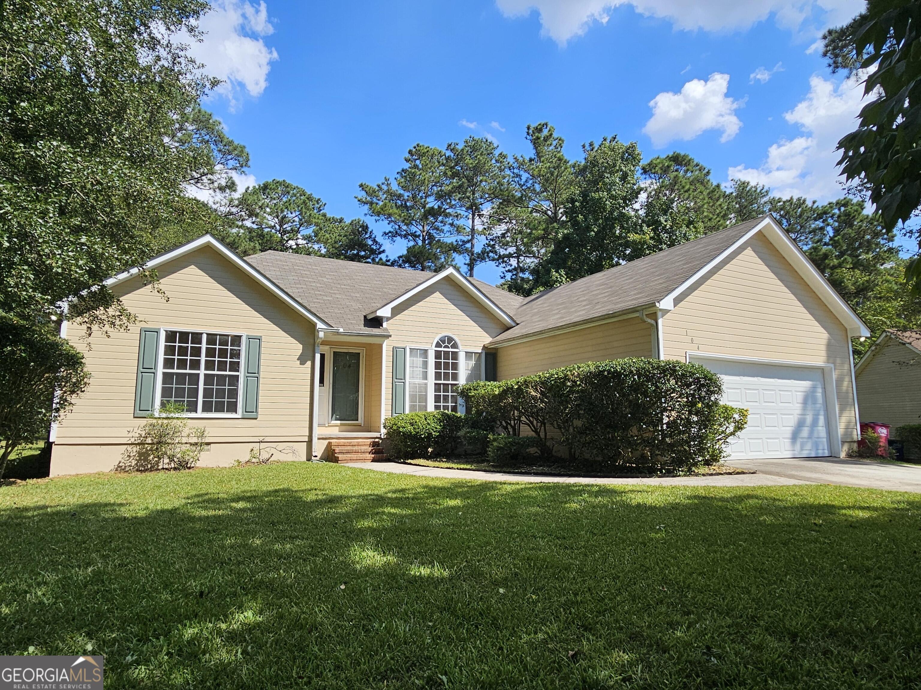 Welcome to this charming home located in Macon, GA. Enjoy the comfort of four bedrooms and two bathrooms, providing ample space for everyone. The property features a spacious living area that includes a large living room with a fireplace, eat-in area in the kitchen, formal dining room, den, home office, and a two car garage. The primary bedroom showcases a stunning trayed ceiling, large walk-in closet, and en suite bathroom that includes a double sink vanity, soaking tub, shower, and private water closet. Situated on a private culdesac, the exterior includes a lovely yard with plenty of room for outdoor activities. This home is conveniently located near local amenities, providing easy access to schools, shopping, dining, and entertainment, with Lake Tobesofkee only 2 miles away.