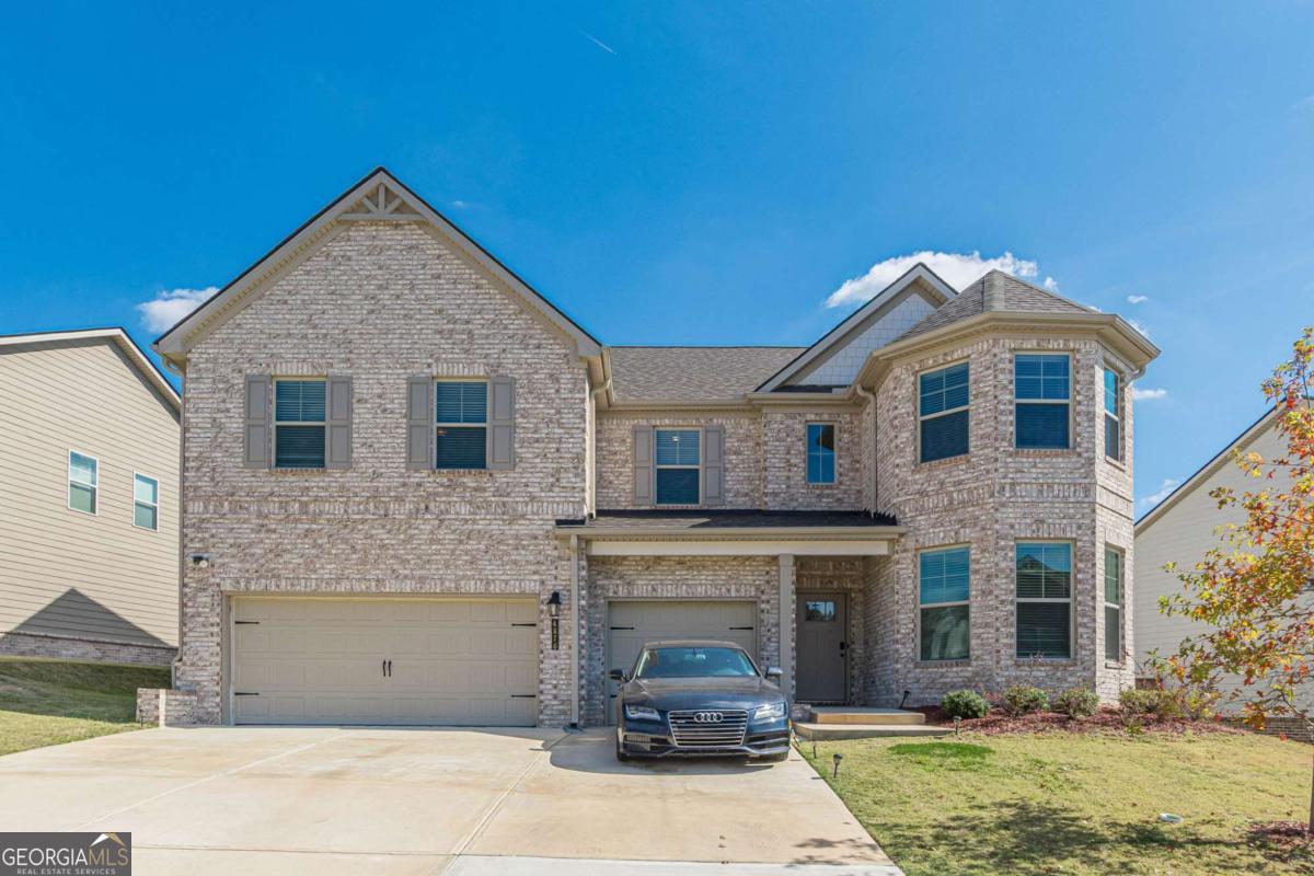 Welcome to your dream home in the highly sought-out, gated community of Camp Creek Village, just minutes from I-285, Camp Creek Marketplace, Hartsfield-Jackson Airport, and Downtown Atlanta! This spacious and elegantly designed 5-bedroom, 4-bath home offers both luxury and functionality, perfect for modern living. Some of the key features are: The oversized Owner's Suite with vaulted ceilings, dual walk-in closets (his & hers), a luxurious sitting room, upstairs living area/loft and spa-style bath with tiled walk-in shower, garden tub, and dual vanities. The Gourmet Kitchen featuring quartz countertops, oversized island, stainless steel appliances, walk-in pantry, and abundant cabinetry. The Open-Concept Main Level has a grand 2-story foyer, formal living and dining rooms, decorative coffered ceilings, and LVP flooring throughout (excluding first-floor bedroom). The bedroom on the main floor is perfect for guests or multi-generational living. Last but not least, the 3-Car Garage for extra storage or multiple vehicles. All located within the prestigious Westlake High School district, this home blends suburban peace with unmatched accessibility to everything Atlanta has to offer!