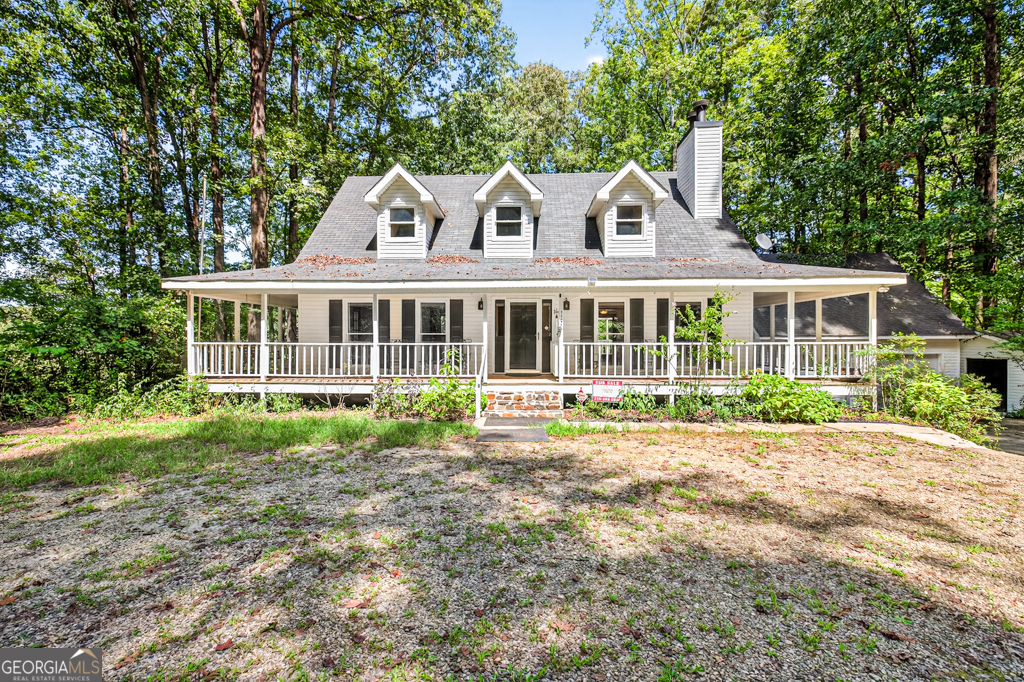 Privacy is an Understatement in this home! 6 wooded acres of privacy overlooking the Barber Creek Reservoir Lake. This home offers a full unfinished basement and an unfinished bonus room over the detached garage. Wrap around porches for entertaining and tranquil living. Gorgeous hardwood floors and new carpet. Solid Oak Cabinets! New Granite Countertops throughout. Tile backsplash, microwave, range/oven and dishwasher complete the kitchen. Jetted tub in master bath with tile floors, double vanities, soaking whirlpool tub and separate shower. Master is on main floor with the same gorgeous hardwoods! The Roof is only 7 years old. The HVAC is only 7 years old. There is a whole house water filtration system. If you are looking for privacy and quiet living, this one is it! Schedule your appointment to see this amazing home!