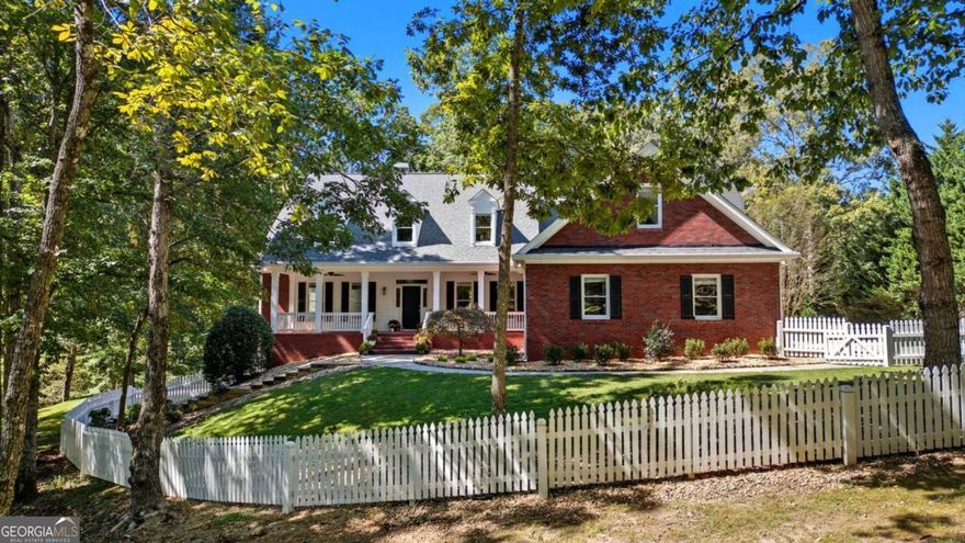 Executive Estate Living: 6,700 Sq Ft of Renovated Luxury on a Secluded 9.99 -Acre Lot.    Welcome to your completely private sanctuary. This custom-built, 5-bedroom, 4-bath residence spans over 6,700 square feet of meticulously updated living space on nearly 10 magnificent acres. With over $100,000 invested in recent renovations, this home has been thoughtfully transformed and is ready for its next owner.    Every detail shines: The interiors feature fresh, contemporary paint, beautifully refinished floors on the main and basement, and brand new luxury vinyl plank flooring upstairs. The heart of the home is the gourmet kitchen, which boasts upgraded appliances, brand-new countertops and backsplash, and freshly painted cabinets. Enjoy the ease of a spacious main-level primary suite.    The home is designed for seamless entertaining. Open-concept living areas flow perfectly for gatherings, while the fully finished walkout basement provides endless possibilities. Complete with a wet bar, this flexible space is ideal for a dedicated game room, a luxurious home theater, or a private in-law suite.    Outdoor life is enhanced by a durable, newly built Trex deck (2024), a covered lower-level patio, and a drive-around entrance. The detached 4-bay garage has been updated with fresh paint and an epoxy floor, creating an ideal workshop or storage area for vehicles and equipment. An updated roof (2021) and professional landscaping complete this stunning package. All this, located just moments from GA 400 access, fine dining, and shopping. This is the ultimate blend of privacy, luxury, and location.