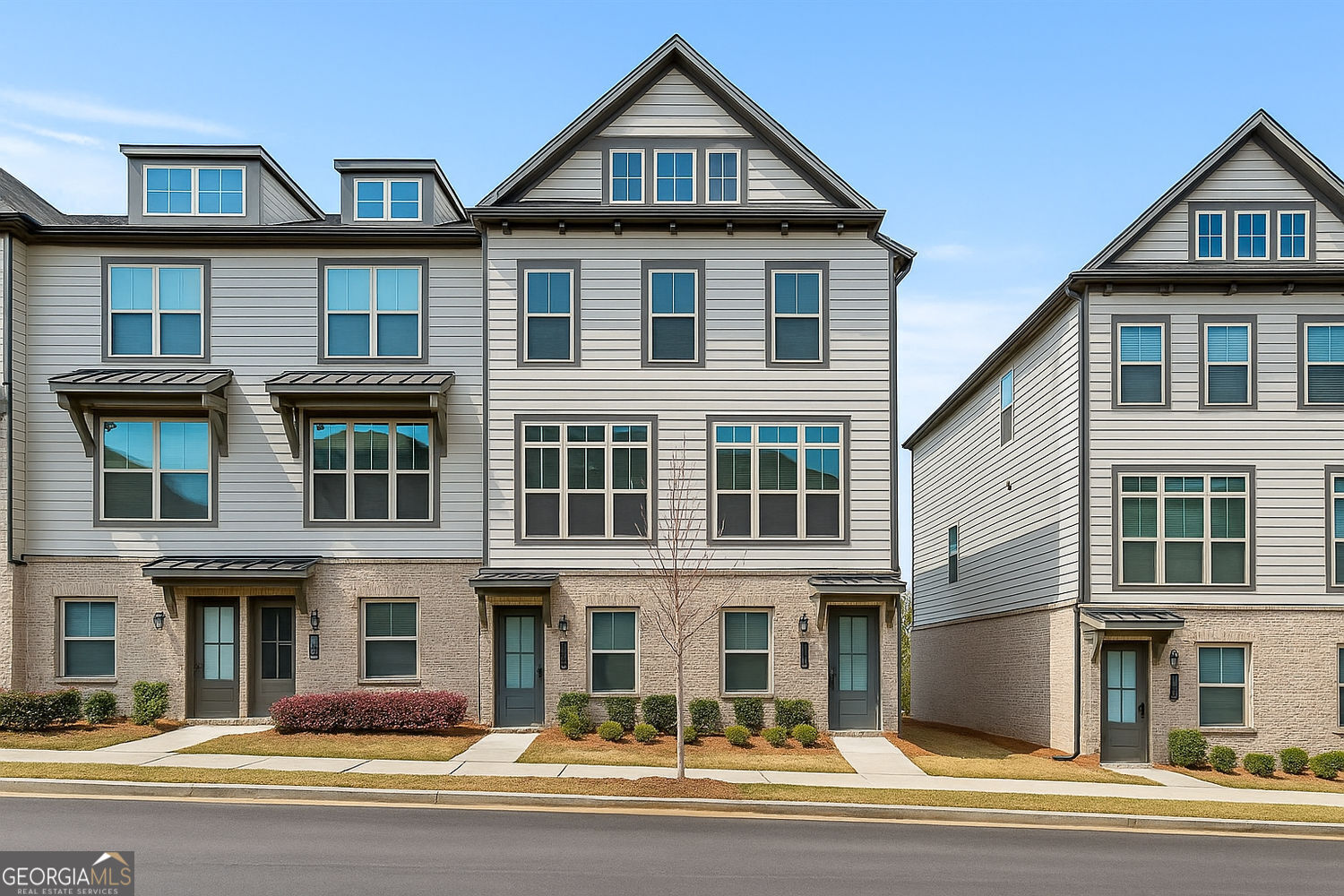 Stylish End-Unit Townhome in Prime Vinings Location! Step into modern elegance with this stunning 3 bed, 3.5 bath end-unit townhome showcasing Ashton Woods' sought-after Bellamy floorplan. Bright, open, and designed for entertaining, the main level features a spacious family room, dining area, and aesthic kitchen with quartz countertops, abundant white cabinetry, and top of the line appliances. Rich hardwood floors add warmth and sophistication throughout the main living spaces. The terrace level offers a private bedroom with an ensuite -- perfect for guests, a home office, or second living area. Upstairs, the luxurious owner's suite includes a spa-like bath with double vanity, oversized walk-in shower, and a generous closet. A second upstairs bedroom with its own ensuite and a conveniently located laundry room complete the upper level. Located in the vibrant Reverie on Cumberland community, you'll enjoy resort-style amenities including a sparkling pool with cabanas, fitness center, fire pit, and beautifully landscaped gathering areas. All just minutes from I-285, I-75, Truist Park, Hartsfield Jackson International Airport, The Battery, and an abundance of shopping and dining options nearby!