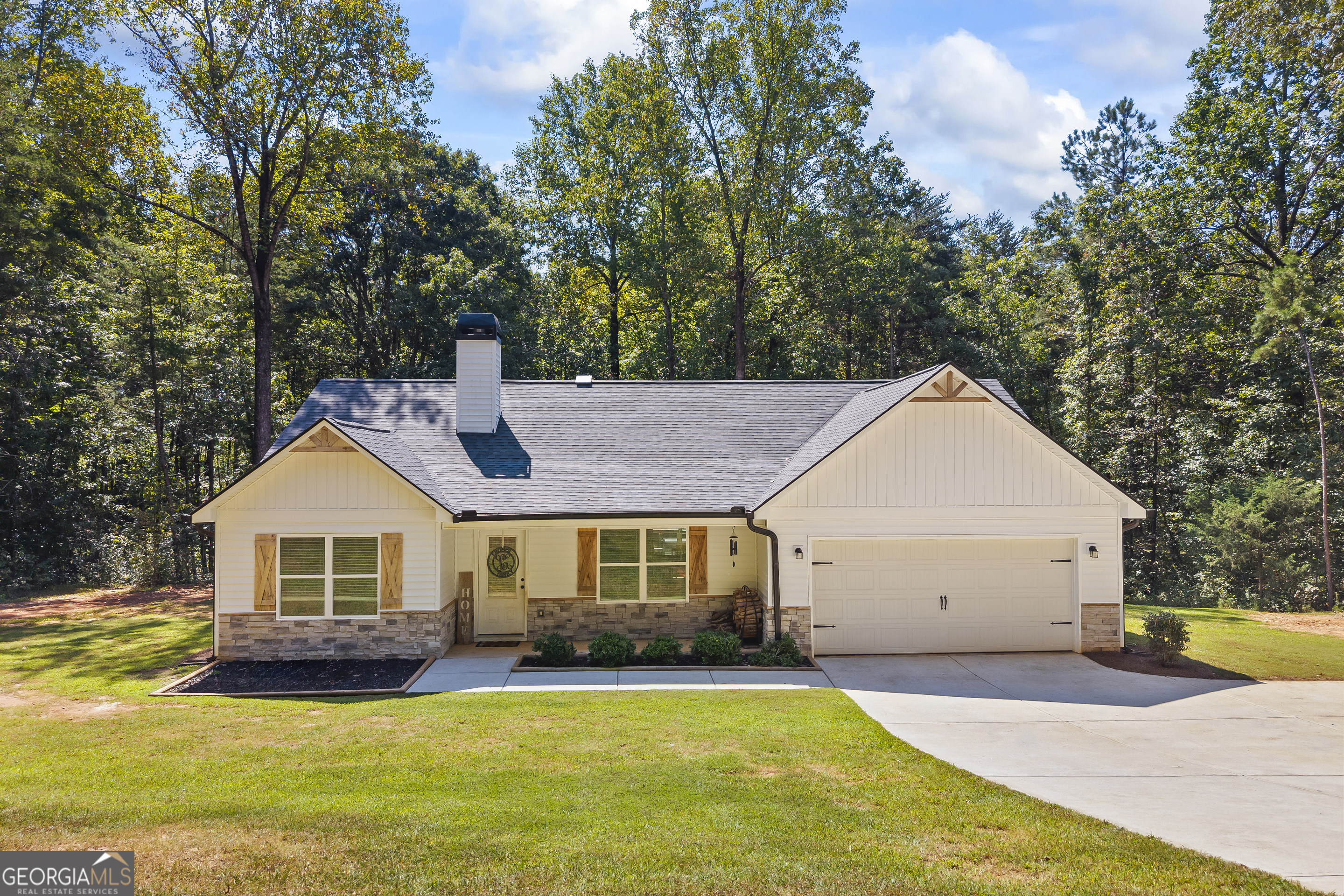 Welcome home to this beautiful 3-bedroom, 2-bathroom property on 2 acres with a spacious, well-kept yard perfect for outdoor living. From the stunning stone accents and upgraded wood shutters to the inviting interior, this home is styled with finishes you'll love. Inside, you'll find a bright, open layout with stainless steel appliances, granite countertops, and a luxurious tile shower. With its prime location, tasteful upgrades, and move-in-ready condition, this home combines style, comfort, and plenty of space to enjoy the best of country living.