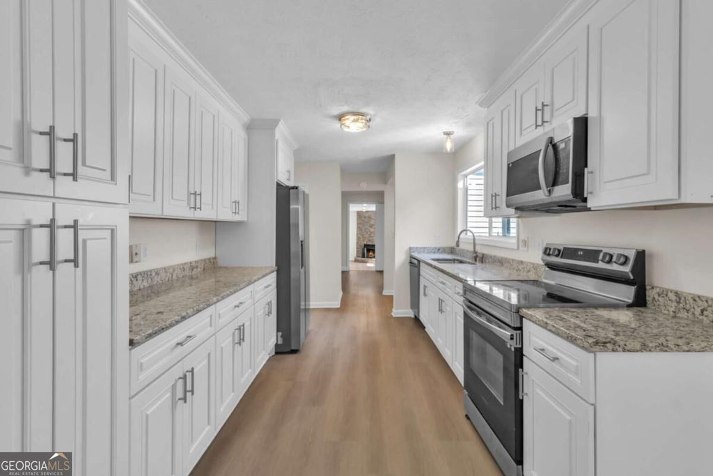 Photo of 661 Bantry Lane, Stone Mountain, GA 30083 (MLS # 10847208)