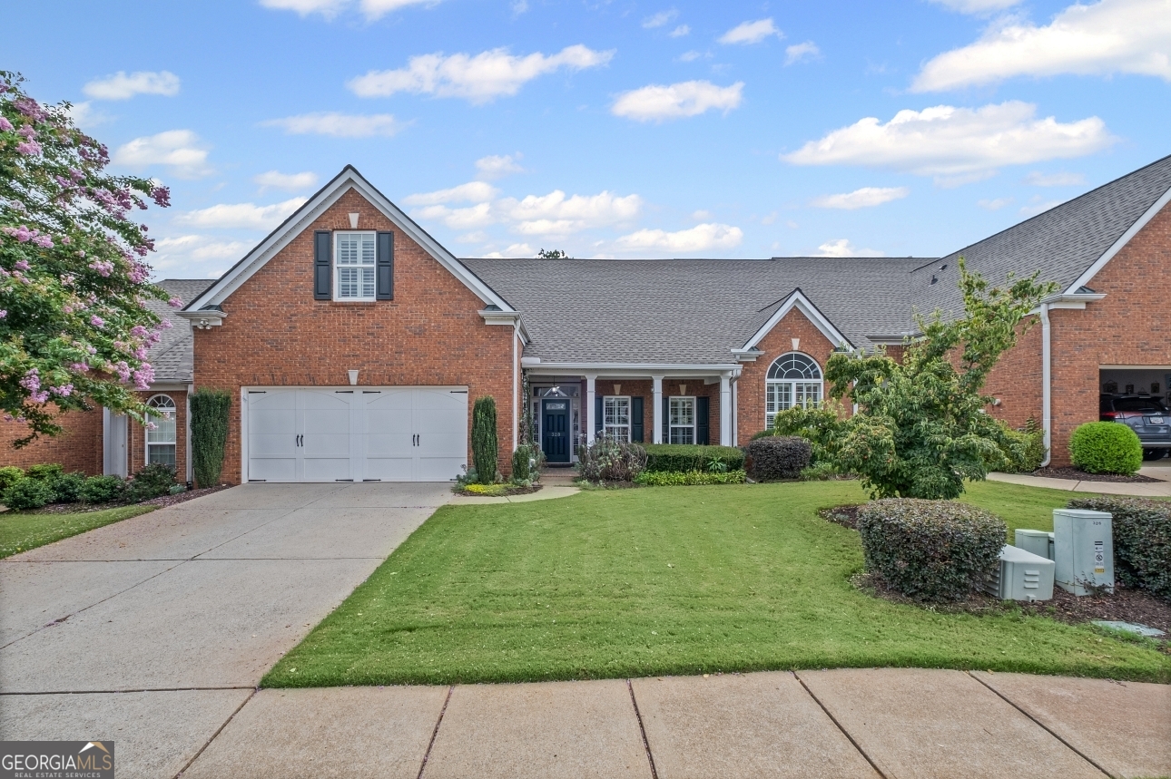 Discover this wonderful home in Claremore Lake, where everyday living feels easy and connected. From the step-free entrance, you're welcomed into a bright, open foyer that flows into the den and kitchen designed for gathering, entertaining, or simply enjoying a quiet evening in. The primary suite on the main level is a true retreat with vaulted ceilings and a peaceful view of the back patio. Another bedroom and full bath with 2 sinks complete the main floor, while upstairs offers a flexible bedroom space perfect for guests, a home office, or a hobby room with its own private bath. With new carpet and luxury vinyl plank flooring added in 2025, the home is ready for your personal touch. Life in Claremore Lake is all about convenience and connection. Residents enjoy a clubhouse, pool, exercise room, planned social activities, lawn care, and exterior maintenance, giving you more time to relax and enjoy your surroundings. Step outside your door and you're within walking distance to shopping, dining, and Onelife Fitness. Downtown Woodstock and I-575 are just a quick drive away. With the HOA replacing all roofs in 2022, you can move in with peace of mind. This isn't just a home; it's a lifestyle, ready for you to make it your own.