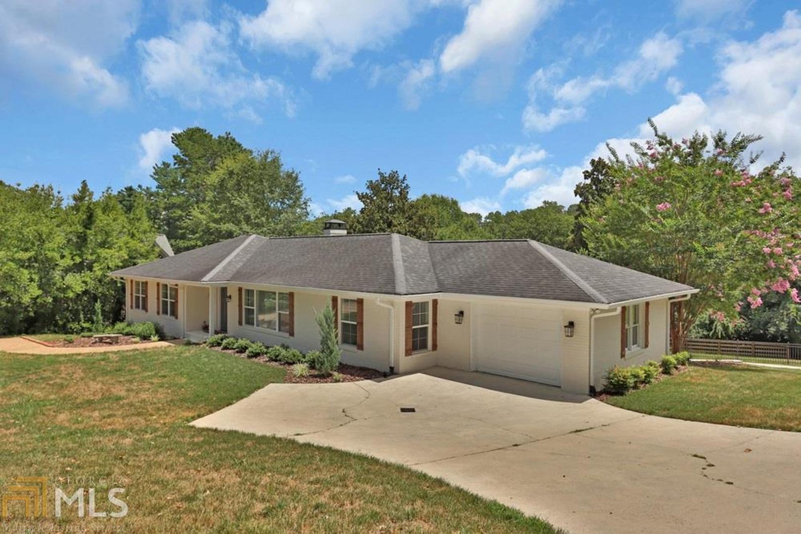Recently updated ranch in a serene sought-after city neighborhood.Close to Northeast GA Medical Center,schools,shopping and dining. Open concept on main level,kitchen highlighted with granite counters,tile backsplash and SS appliances.Updated light fixtures throughout including HW and ceramic tile flooring. Professional front and backyard landscaping showcases the newly installed fiberglass pool and patio area complete with built in stone fire pit,new Trex decking and fully fenced back yard. Fin. basement with gorgeous full bath, private garage,bonus room and guest room/office.Stunning home with so many upgrades!