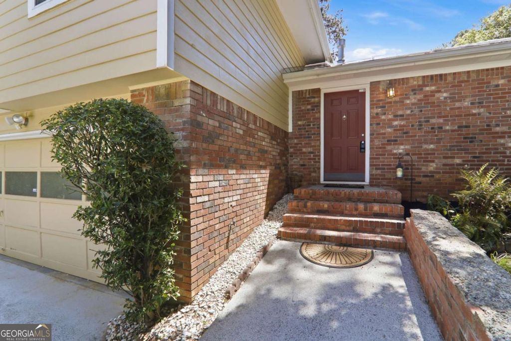 Photo of 5642 Breezy Court SW, Lilburn, GA 30047 (MLS # 10740141)