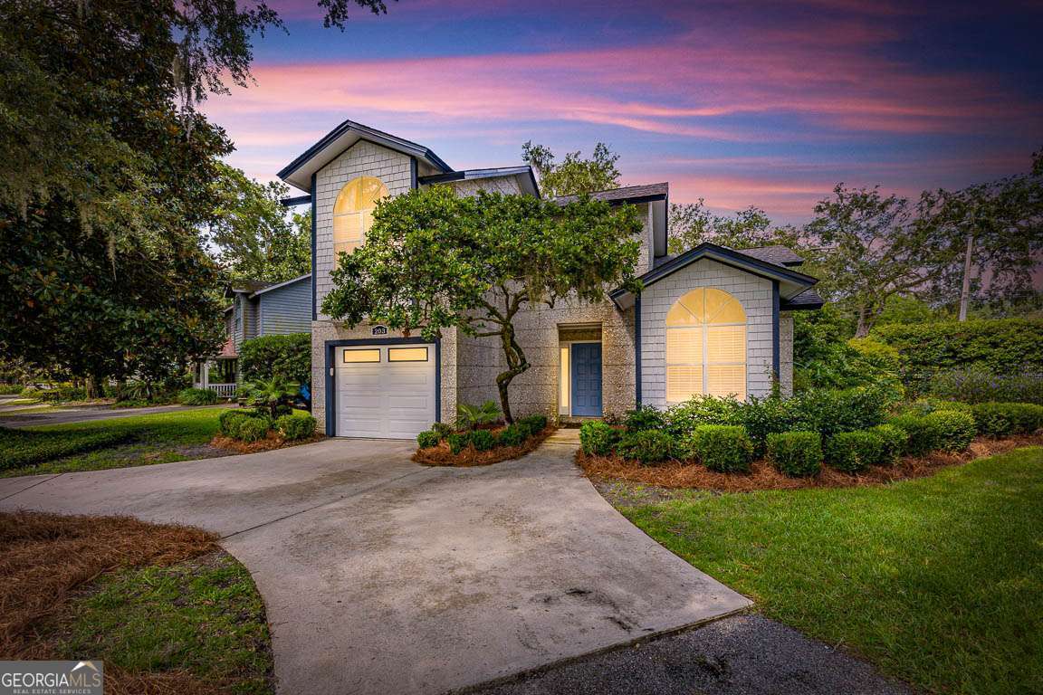 Welcome to 203 Grand Oaks - a beautifully maintained 3-bedroom, 2.5-bath tabby Coastal Contemporary home located on the sought-after South end of St. Simons Island. This 1,744 sq ft residence offers an ideal blend of comfort, style, and convenience, just minutes from the beach, shopping, and popular dining spots. The spacious floor plan features a vaulted living room ceiling and a cozy wood-burning fireplace, creating a warm and inviting atmosphere with an abundance of natural light and windows. The primary suite is conveniently located on the main level and includes ample closet space and a private en suite bath. The open kitchen is perfect for entertaining with granite countertops, stainless appliances, a breakfast nook, and a separate formal dining area open to a breakfast bar. Enjoy indoor-outdoor living with a lovely screened porch that leads to a charming brick paver patio and an expansive backyard-fully fenced for privacy and ready for gatherings, pets, or play. Gorgeous hardwood floors run throughout the main living areas, travertine in the wet areas, and granite counter tops adding timeless elegance to this move-in-ready home. Residence has just been repainted and also has a brand new roof! Whether you're looking for a full-time residence or vacation home, 203 Grand Oaks offers a fantastic opportunity to own on St. Simons Island in a prime location.