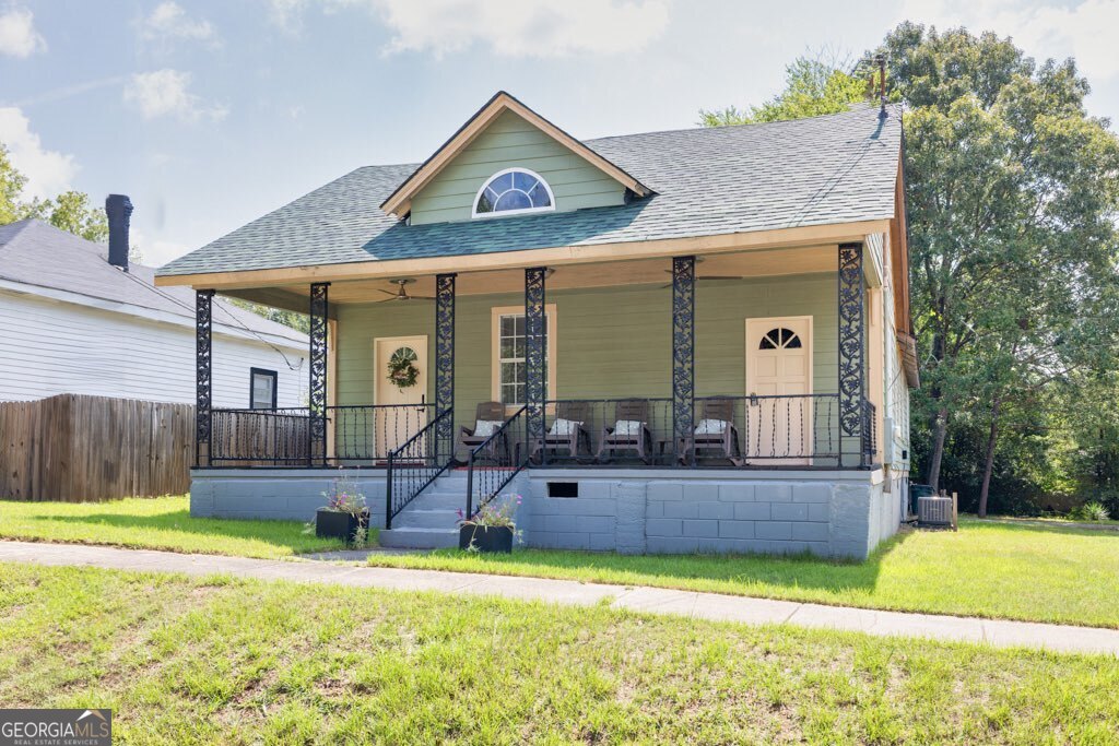 Charming historic bungalow located just a short walk from downtown Porterdale. This 2-bedroom, 2-bath home is currently operating as an Airbnb and can be sold fully furnished, offering a great investment opportunity. Features include a brand-new water heater and a functional layout with room for updates. Enjoy all that this growing area has to offer, including new restaurants, parks, and the scenic Yellow River just steps away.