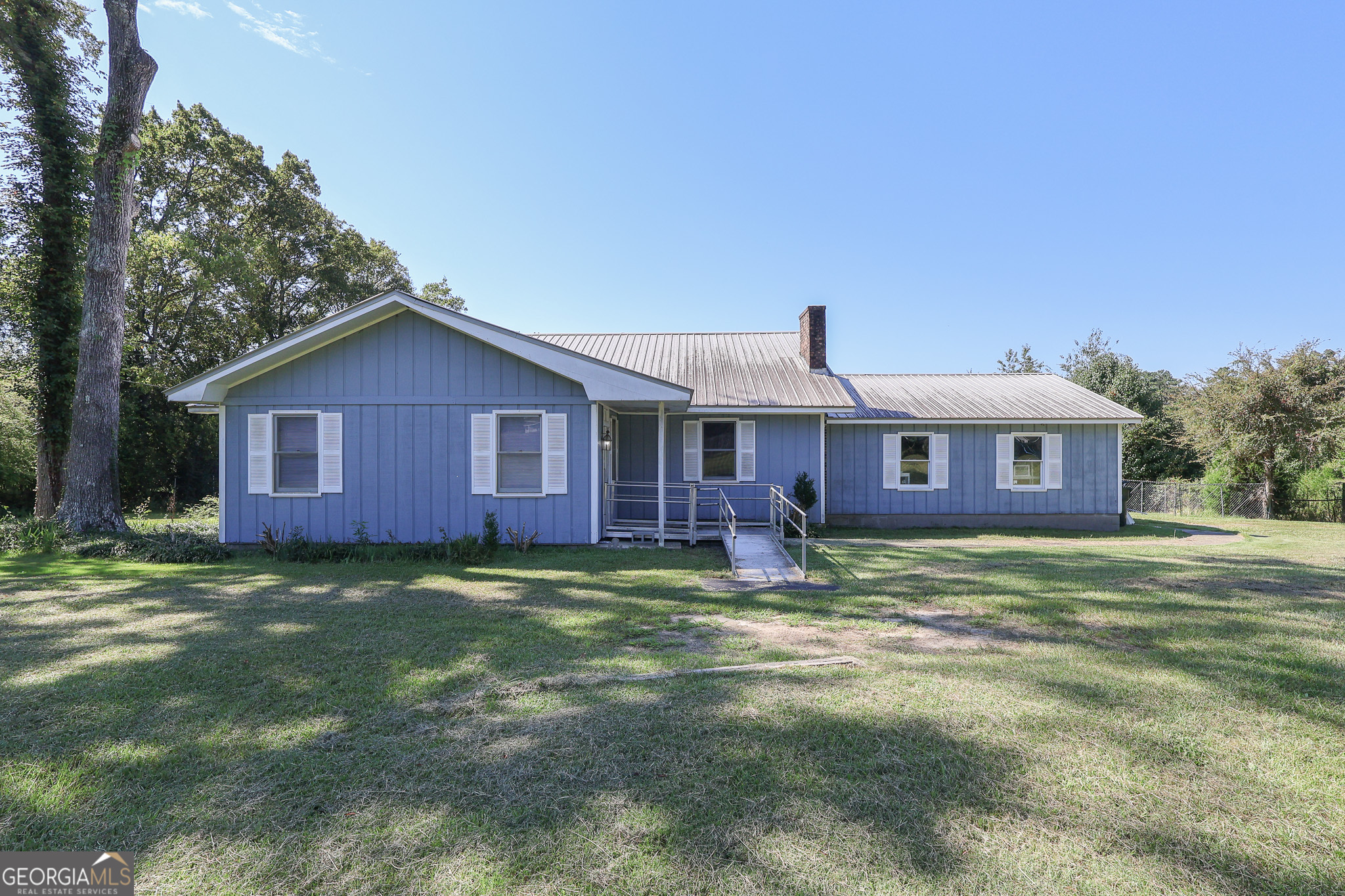 Tucked off the main road for added privacy, this 3-bedroom, 2.5-bath home in Macon sits on a spacious 1.85-acre lot. The large fenced back yard offers plenty of room to relax or play, while a wired barn with water access provides great potential for storage, hobbies, or animals. An additional outbuilding adds even more flexibility. Whether you're looking for space to spread out or a property with room to make your own, this home is full of opportunity. Being sold as is.