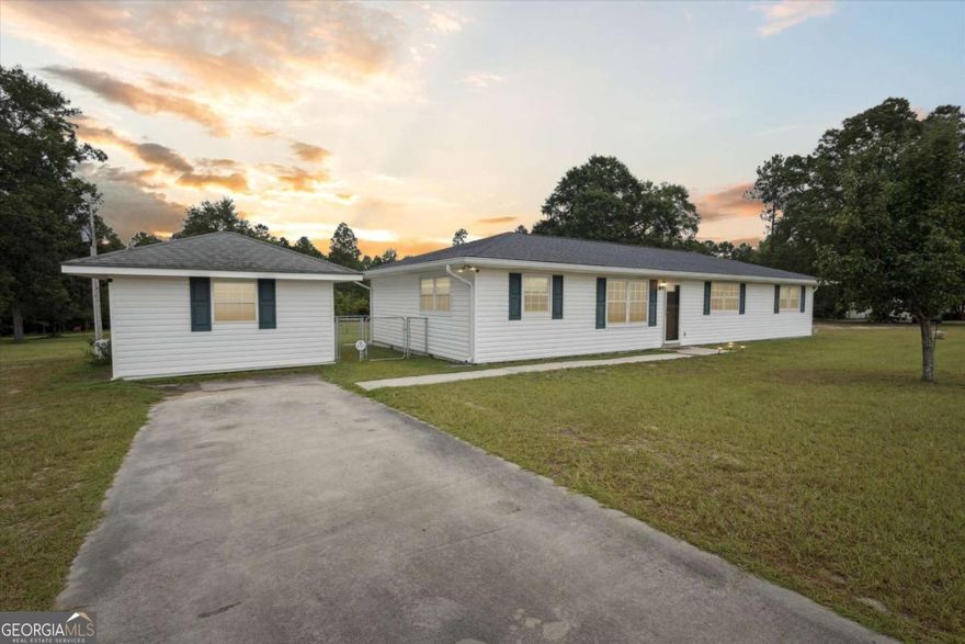 MOTIVATED SELLER! Rare country + modern ranch style home with a second dwelling situated on nearly 2 acres, perfect place to call home or an ideal opportunity for investors seeking an income producing property. This property features two separate dwellings, fully maintained and equipped with all major systems and appliances. Main house has a brand new roof, updated gourmet kitchen with subway tile backsplash, stainless steel appliances, new countertops, cabinets and fixtures with oversized bedrooms and LVP flooring throughout. Step outside the french doors leading to the back covered patio that overlook your expansive slice of privacy on 1.87 acres with powered workshop, detached covered storage awning, shed, and chicken coop ready for your mini dreams or rent potential. Second house offers a full kitchen, living area, bathroom, laundry, fireplace, as well as separate water heater, heating and air conditioning. Call today to see this rare, flexible opportunity with plenty of room to roam, no HOA, detached ADU for multi-generational living or income-producing residence! Only an hour from major employers such as Gulfstream and GA Ports Authority.
