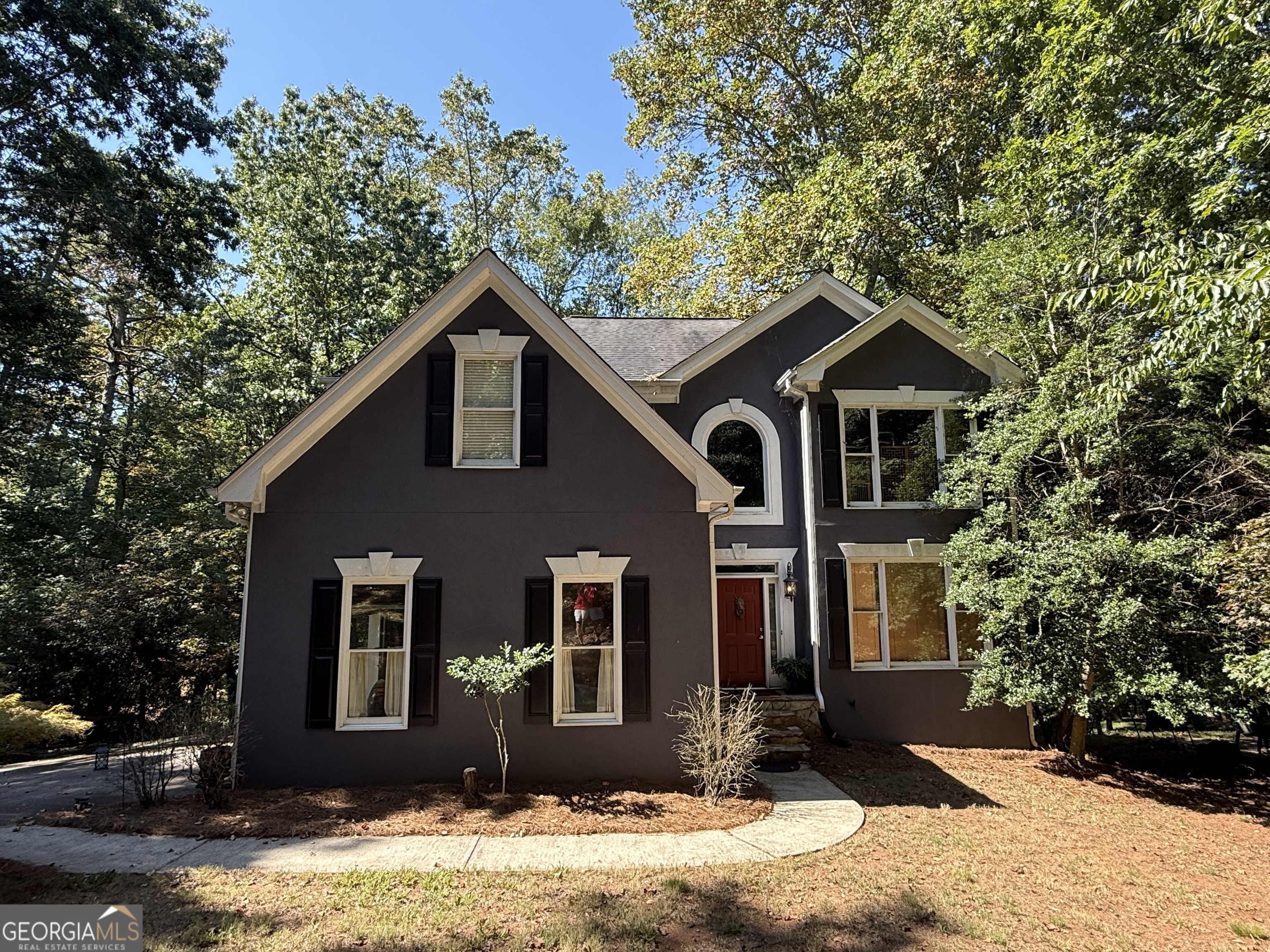 JUST STEPS to Lake Lanier! LOCATION! LOCATION! LOCATION! Affordable Lake Living!! Minutes from Lake Lanier's parks, marinas, and outdoor adventures. NO HOA!! Opportunity knocks for a Savvy Investor or Buyer looking for some sweat equity. Two-story 3BR/2.5BA home on PRIVATE .59 Acres but feels like much more. Don't miss out on this exceptional opportunity to make your mark on a property primed for transformation. Overlooks a private backyard with tons of wildlife. Huge Master Suite & Retreat upstairs. Finished Basement with a half Bath could be converted to Full Bath making 4th Bedroom in Basement. Excellent Forsyth County schools & in East Forsyth High School district. AS-IS Sale, needs some deck work & Driveway needs repair. Hardcoat stucco in good shape. Schedule your Appt today!