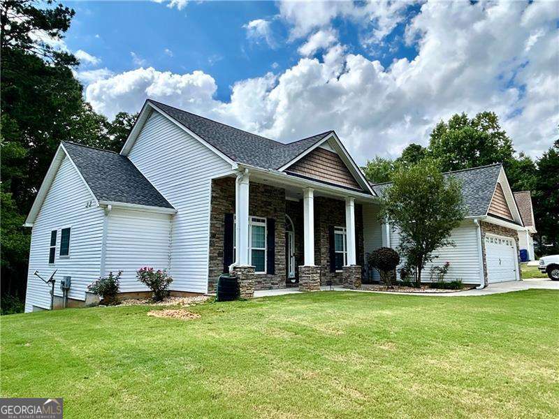 Look No Further!! Check out this lovely ranch home with beautiful rocking chair front porch! You will love the privacy this home offers with just 6 homes in this subdivision, you have a large lot and no traffic driving through! This home offers so much square footage! Over-sized master bedroom with trey ceilings and onsuite with double vanity, separate shower and soaking tub, large walk-in closet and tall ceilings! Huge family room with vaulted ceilings, separate dining room and formal living room. Gorgeous kitchen with tons of cabinets and counter space, breakfast bar and breakfast area. Two spacious secondary bedrooms with large closets. Home also offers a full finished basement, perfect for mother-in-law or teen suite. Terrace level has family room/media room, 3 bedrooms, full kitchen, Laundry room, exercise room, boat door and storage. You can also sit out on your large back deck and enjoy the peace and quiet or sit under the back patio and relax. With this half acre lot, you have tons of space to add a pool, fire pit or other outdoor living space.