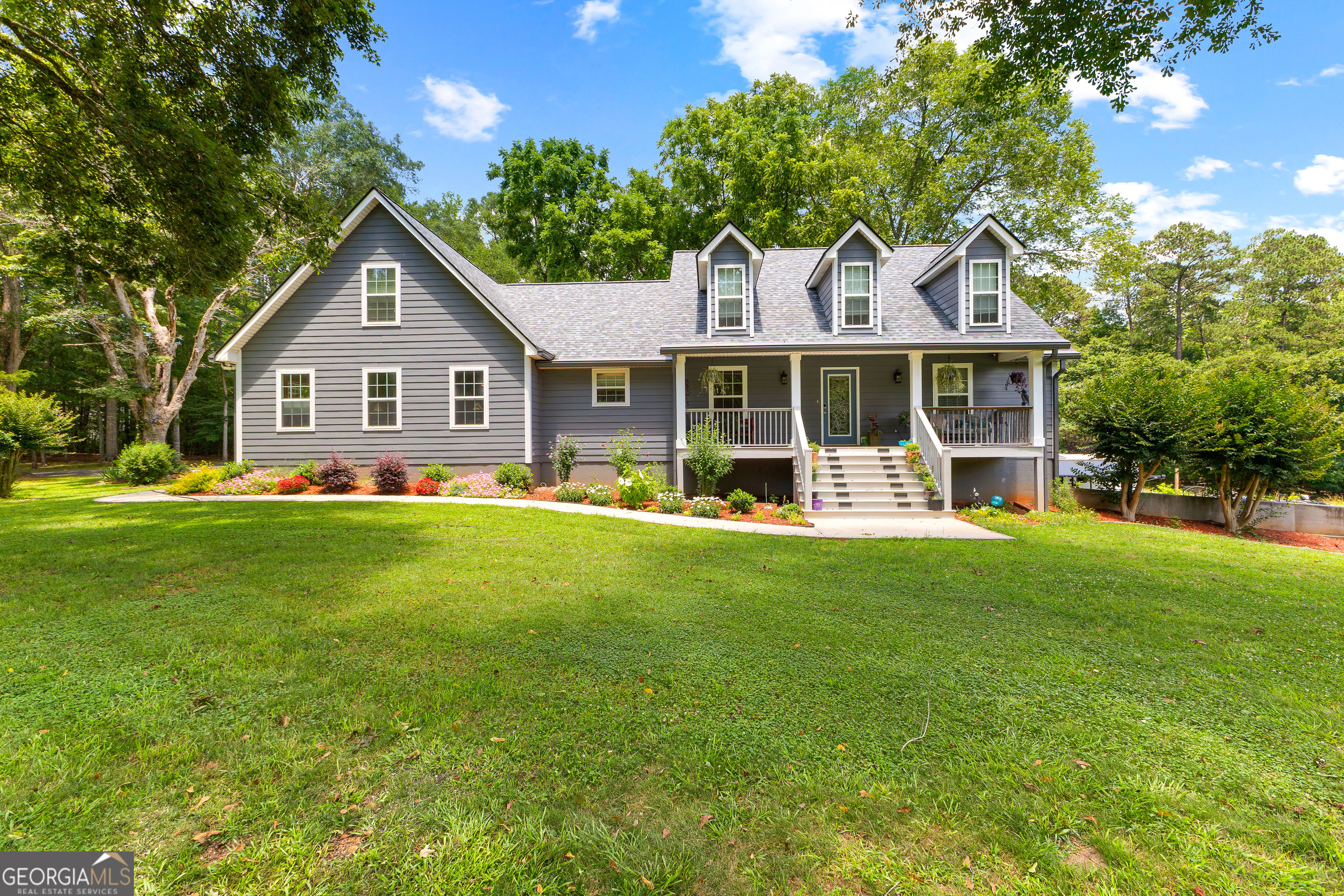 Welcome to your Dream Home! Nestled on 8 Acres of Flat Picturesque Land! This Beautiful Home offers the perfect combination of Modern Living and Serene Country Charm. Inside features a bright and open floor plan with living areas that flow seamlessly creating a warm and welcoming atmosphere! The Kitchen offers an inviting center island, upgraded light fixtures and a pantry with a custom door. Desirable Master-on-Main with a generous sized walk-in closet, double vanities, and separate shower. Two additional bedrooms and an additional full bathroom are also included on the main level. Impressively sized bonus area upstairs offering endless possibilities-perfect for guests, in-laws, teens or a private home office complete with a full bathroom and plumbing for kitchen area. The basement area adds significant value with all the possibilities it offers. Perfect workshop area that is a tool lovers dream! It even has a separate driveway and entry! Covered Front and Back Porch perfect for relaxing and taking in all nature has to offer! This one has so much to offer. It is truly a MUST SEE!