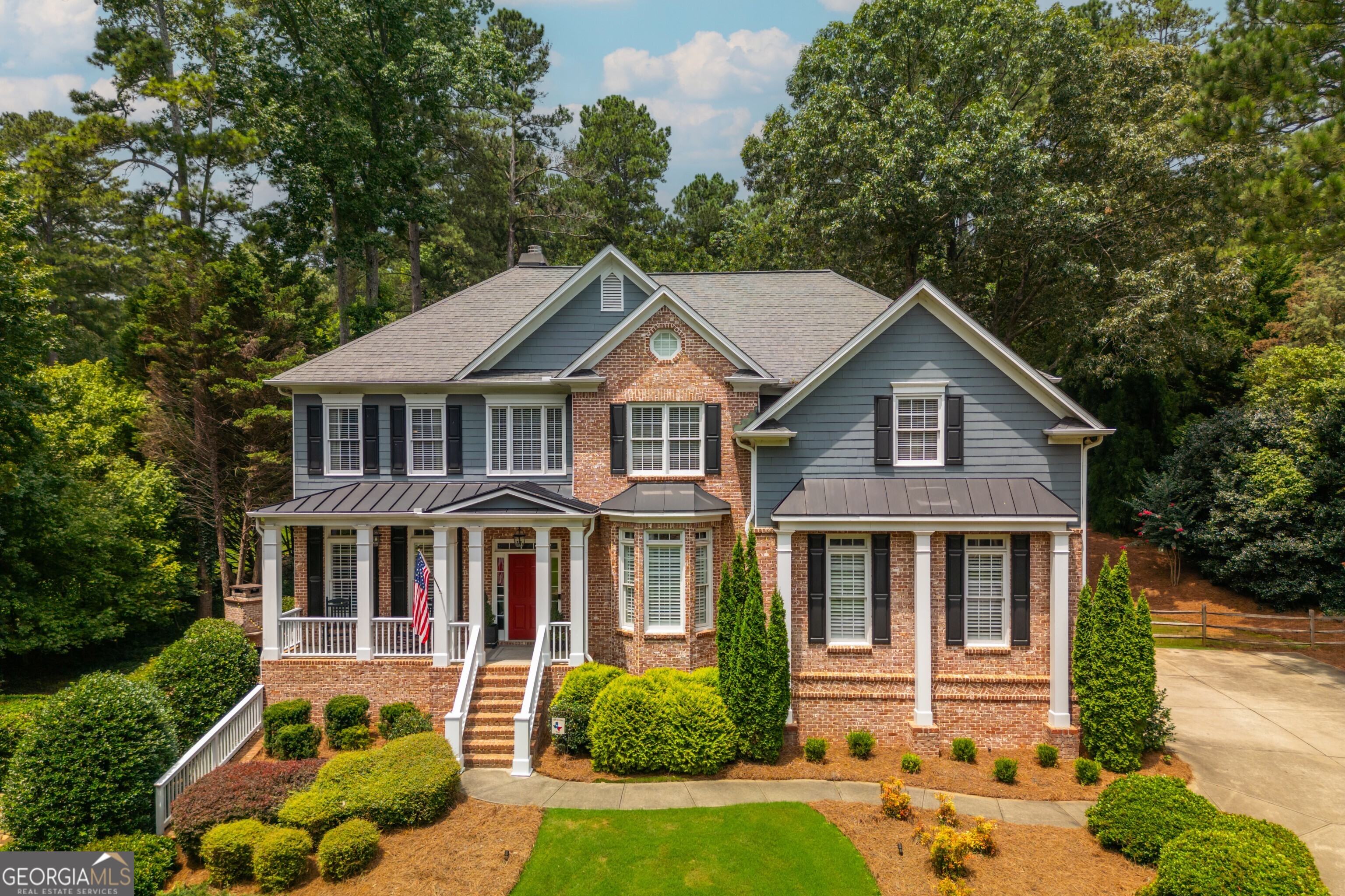 Nestled in the desirable Reddstone neighborhood of Milton, this beautiful 6-bedroom, 5-bathroom home presents an unparalleled blend of spacious living and prime location. Set on a generous acre lot, this Milton home welcomes you with its inviting curb appeal and beautiful mature landscaping. As you enter the home, you're greeted by a grand two-story foyer. To the side, a sitting area with a coffered ceiling and a dining room with wainscot paneling and a tray ceiling exude elegance. The gleaming hardwood floors guide you through an open and flowing layout to the heart of the home, featuring the family room with floor-to-ceiling windows, open-concept ceilings, a fireplace, and built-in shelving. Just off the family room is the meticulously appointed kitchen with granite countertops and a large island, perfect for entertaining. Adjacent to the kitchen, the expansive living areas provide comfortable spaces for relaxation and gathering, with abundant natural light and a seamless transition to formal dining and a private office or guest suite. Family and guests can gather on the screened-in porch overlooking the large backyard. Ascending to the upper level, you'll discover the luxurious master retreat, a true sanctuary boasting a sitting area, a spa-like ensuite bathroom with dual vanities, a soaking tub, and a separate shower, along with generously sized walk-in closets. Four additional well-appointed bedrooms and three full baths offer comfort and privacy for family and guests, each thoughtfully designed with ample space and natural light. The finished basement provides an extraordinary extension of living space, ideal for recreation, hosting guests, and entertainment. This versatile level offers a full bedroom and bathroom, perfect for an in-law suite, private guest quarters, or potential office suite. There is plenty of room for a media room, home gym, or play area, featuring daylight windows and walk-out access, truly catering to every lifestyle need. Outside, the private backyard oasis awaits, offering a serene escape for outdoor enjoyment and entertaining. The spacious patio is perfect for hosting barbecues, enjoying quiet mornings in front of the stackstone fireplace, or simply appreciating the lush greenery. The expansive acre lot offers plenty of space for outdoor activities and potential enhancements. This exceptional home is ideally situated close to the charming boutiques and eateries of downtown Crabapple and the vibrant amenities of Alpharetta, offering the best of both worlds-tranquil suburban living with easy access to urban conveniences. Furthermore, residents benefit from access to some of the area's most highly-regarded schools, making this an ideal place to call home for families seeking the Milton lifestyle.