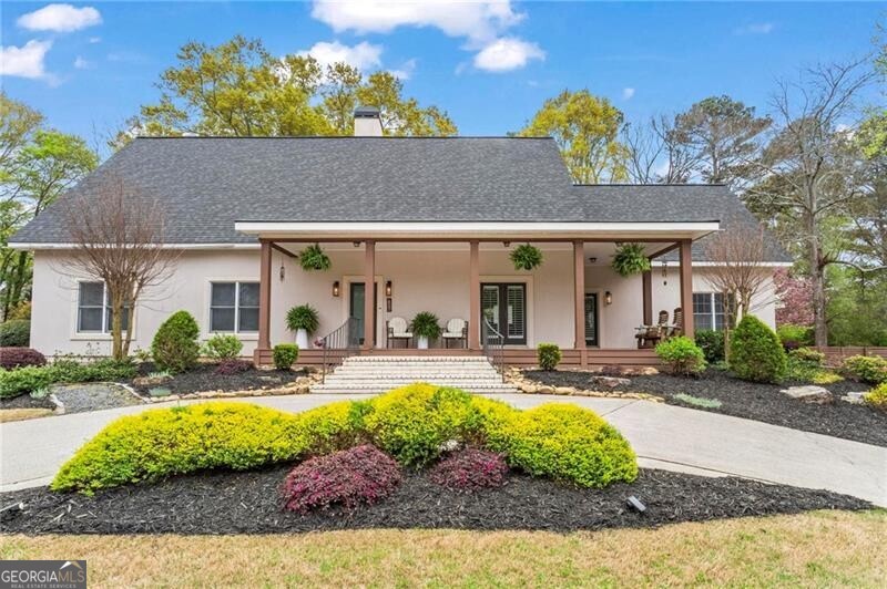 WELCOME HOME to this One-of-a-Kind Estate in Downtown Alpharetta. Experience unparalleled living in this all-steel construction ranch home. The main level features an open-concept design with soaring ceilings and abundant natural light, creating a spacious and inviting atmosphere. Three well-appointed bedrooms, including a primary suite ready for customization, provide comfort and style. Upstairs, a large bonus bedroom with a loft and full bath adds versatility. This home is a car enthusiast's dream, featuring a garage that can accommodate up to 6 vehicles plus a dedicated workshop area. A 2,970 sq ft unfinished basement with a bath offers endless potential for customization. Situated on a private 3/4-acre lot, the professionally landscaped backyard is an entertainer's paradise, complete with a large, expansive deck, pool, pickleball/basketball court, and a storage pool house. Enjoy the privacy and luxury of this incredible home. Located in one of the top school districts, this home offers access to some of the best schools in the area. All of this, just steps away from downtown Alpharetta a rare opportunity to own a home unlike anything else in the area.