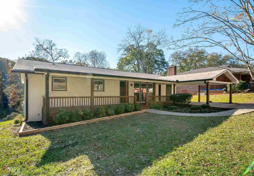 This Home Has It All! Gorgeous down-to-the-studs renovation in the perfect Gainesville community! Nestled 5 minutes from Lake Lanier and Downtown Gainesville, 1 Block away from a huge public park with playground, softball field and pavilion, and so convenient to dining, shopping, and entertainment  you will instantly fall in love with this perfectly appointed home! Check out the Custom Kitchen!  One of the largest hand-built granite islands youGÇÖll ever see, top of the line appliances, perfect lighting, and oil rubbed bronze hardware to emphasize pristine white cabinets!So Many Upgrades! Beautiful Bamboo flooring in the open concept living areas, farmhouse style fixtures, all new lighting throughout, new HVAC, Roof, Plumbing, and Electrical. Floor to Ceiling Windows in the dining room, a new Laundry Room /Pantry, new ceiling fans, bedroom carpets, and a Third Full Bath! Visit with neighbors from the rocking chair front porch, and entertain on your brand-new deck! This is truly Must See, Must Move In!