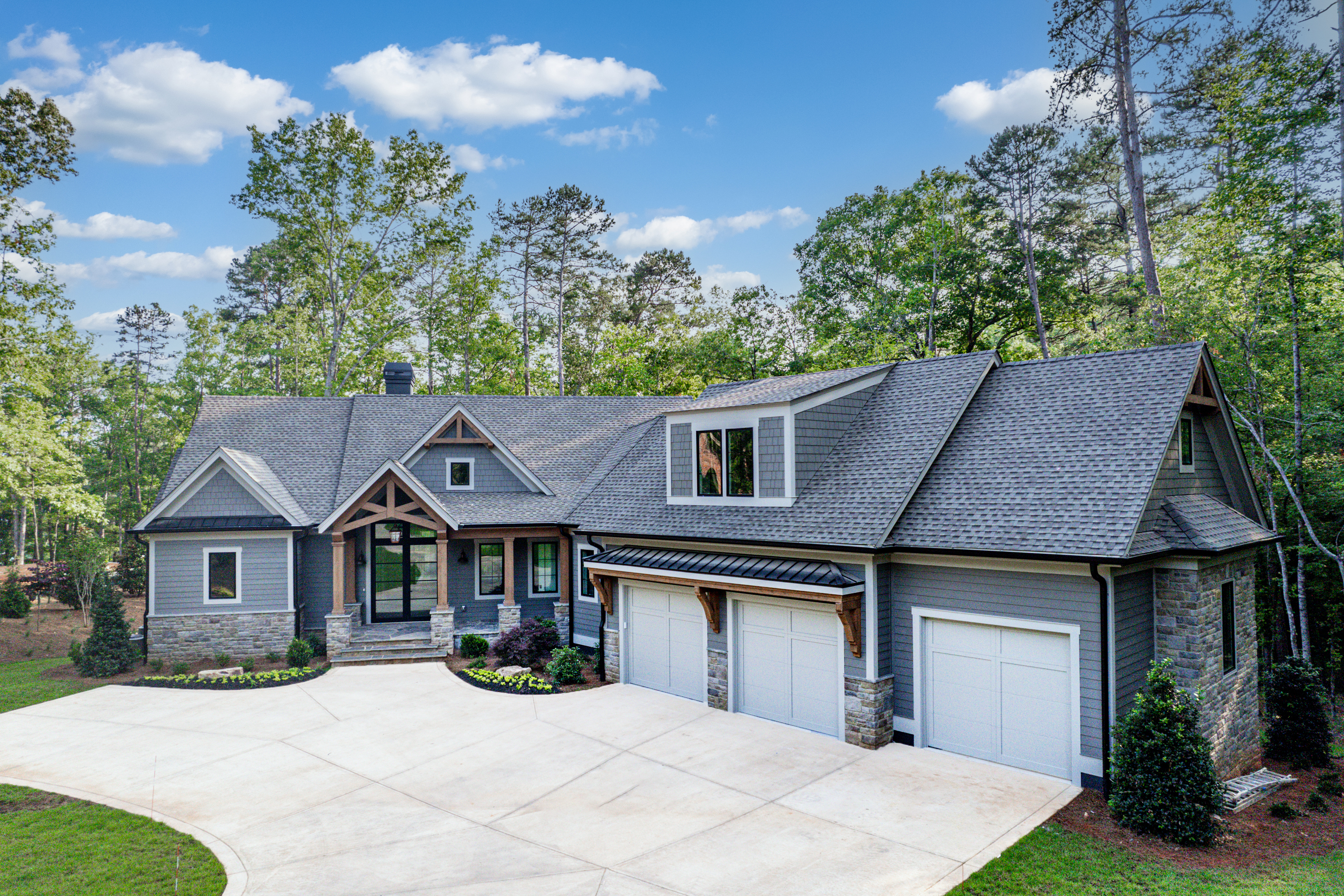 MOVE IN READY!! QUALITY, BRAND NEW CONSTRUCTION, ONE OF A KIND LAKEFRONT HOME IN REYNOLDS, LAKE OCONEE, LOCATED WITHIN THE HIGHLY SOUGHT-AFTER RICHLAND POINTE OF LAKE OCONEE. Another desirable build from LUXURY home builders, Freedom Construction. 1223 Fox Squirrel sits on a cul-de-sac in a cove with deep water views. This luxurious home is constructed with relaxation and entertainment in mind, featuring high-end craftsmanship with beautiful wide plank wood flooring, vaulted ceilings, 6 bedrooms, 6.5 bathrooms with custom closets featuring 6 vast en-suite bedrooms. 2 en-suites on the main level, with a CHEF'S KITCHEN boasting SUBZERO/WOLF appliances, custom built cabinets, a considerable island, quartz countertops and gorgeous tilework throughout. The master offers soaring ceilings, his/her closets and an exclusive bath making this your own private haven. 2 expansive ensuite bedrooms can be found above the garage. Find yourself entertaining guests on the terrace level with a huge GAME ROOM, oversized BONUS room, BAR, and WINE CELLAR with sizeable sliders that lead to a POOL and SPA on this private, waterfront lake lot with a MAX DOCK. The 3rd level also offers additional room for guests with 2 en-suite bedrooms. 3 total fireplaces (2 outside) boasting custom stonework. 3 car garage. Embrace a lifestyle of resort living within this gated community, with access to six championship golf courses, 10 distinctive on-site restaurants, 21 miles of hiking and biking trails, 374 miles of shoreline, and a Ritz Carlton. Seller is making a membership available.